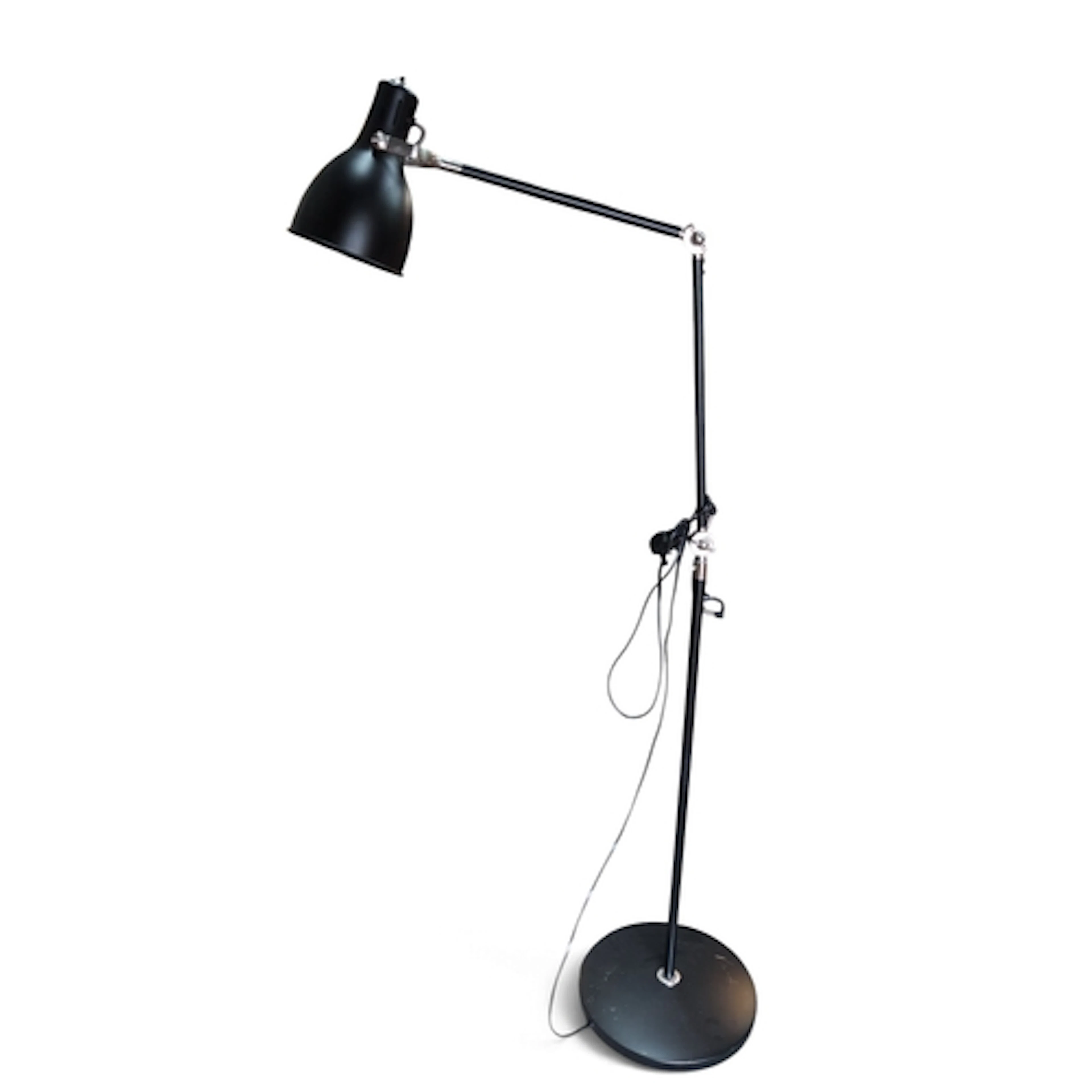 Black metal floor lamp with an adjustable cantilever arm, po...
