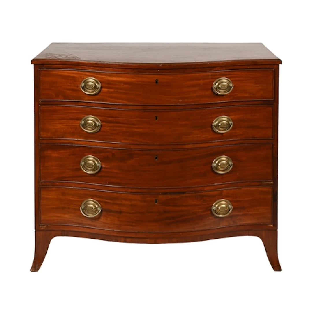 A Victorian serpentine mahogany chest of drawers, of four gr...