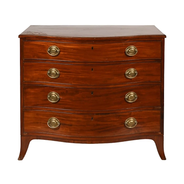 A Victorian serpentine mahogany chest of drawers, of four gr...
