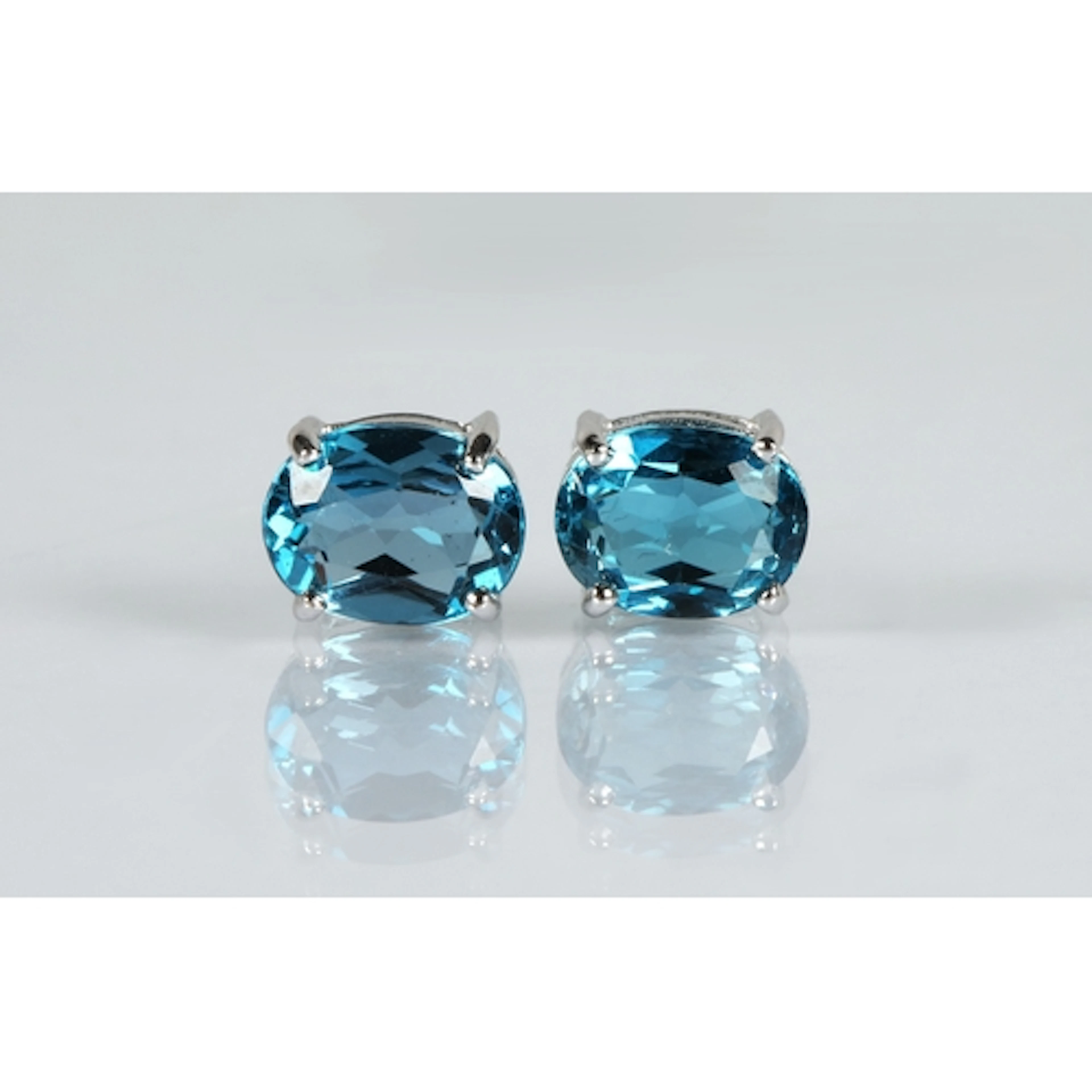 9ct white gold blue topaz earrings with certificate of authe...