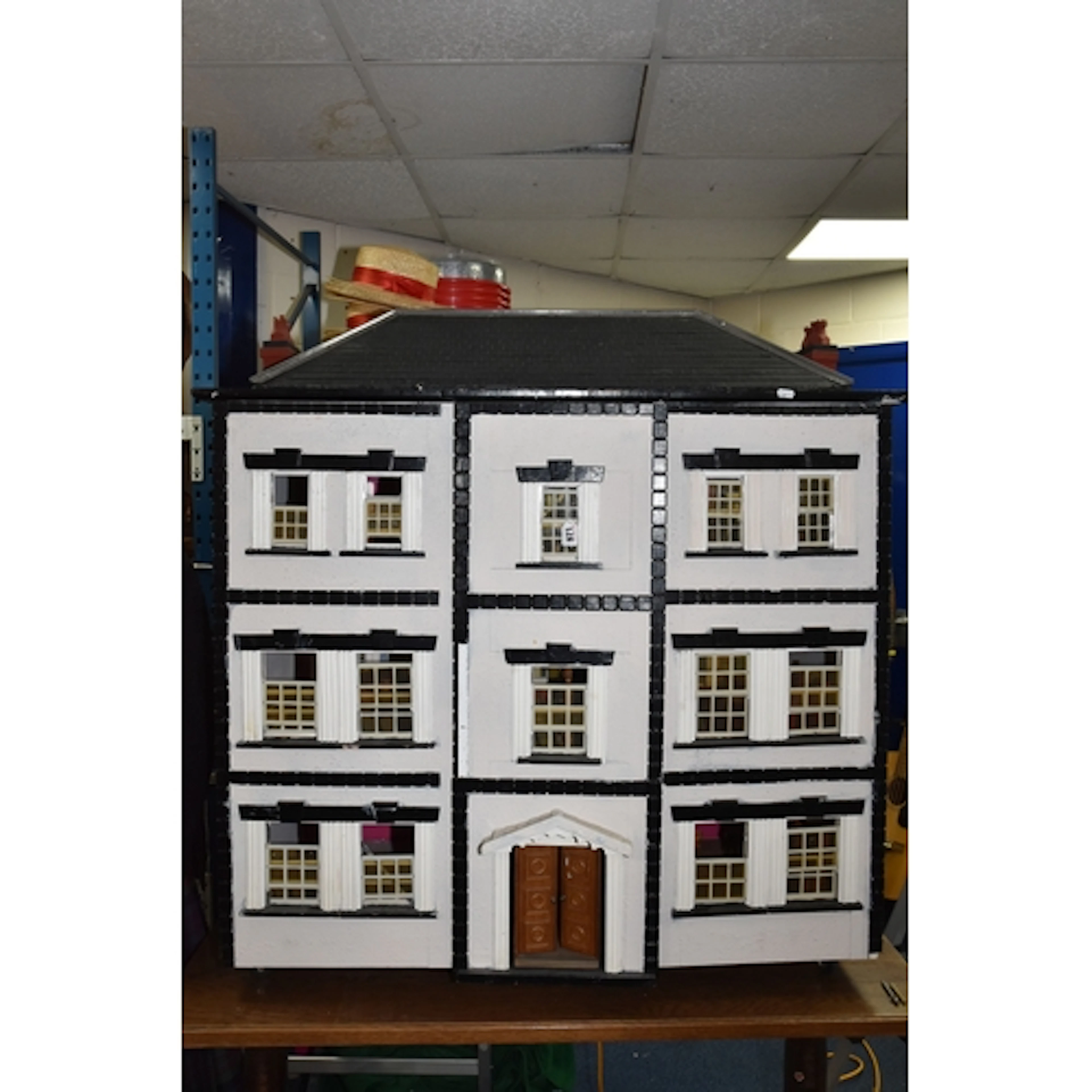 A LARGE SCRATCH BUILT/CUSTOM BUILT THREE STOREY DOLLS HOUSE,...