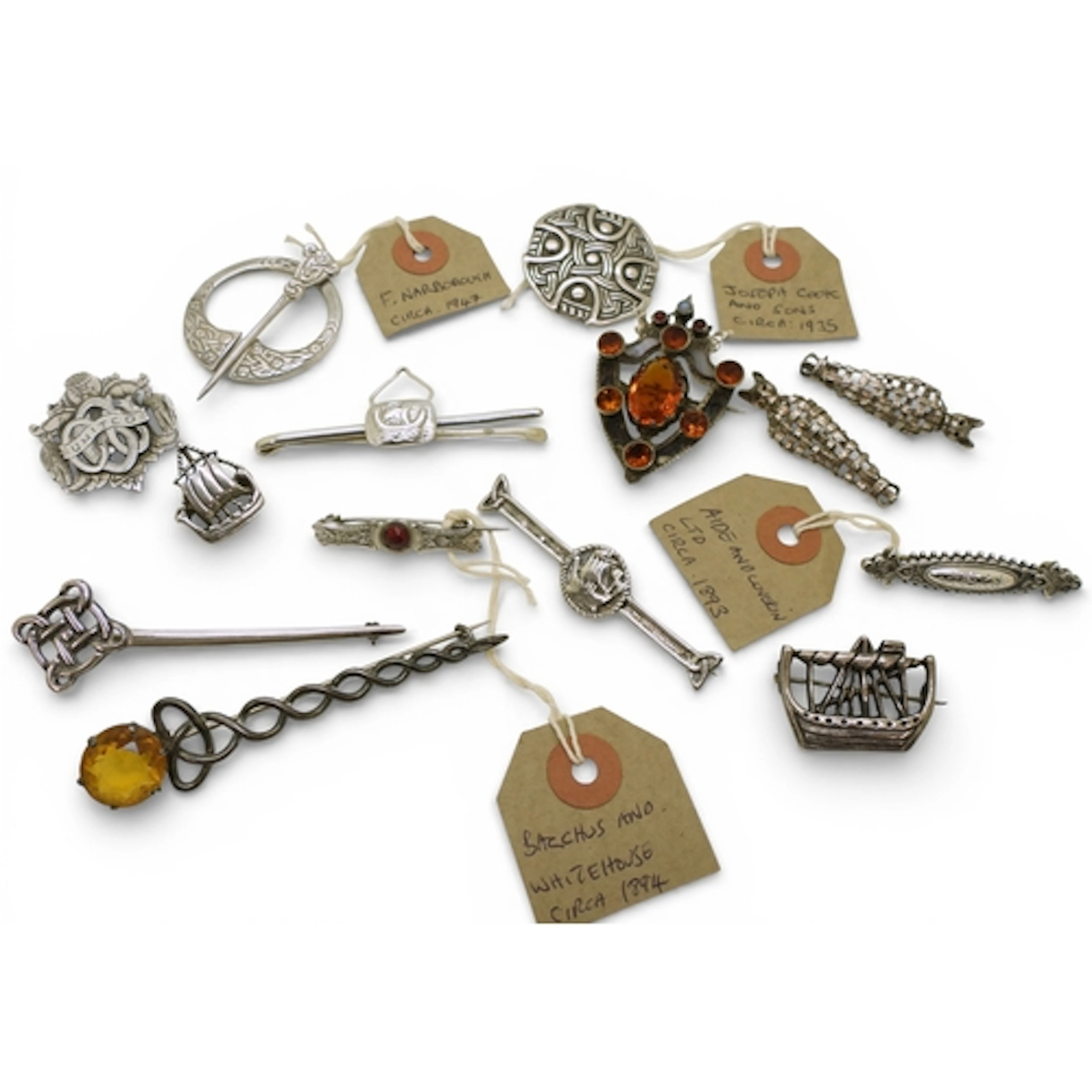 A collection of Scottish and other silver and white metal br...