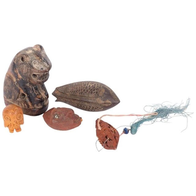 A collection of interesting carved wooden items, including a...