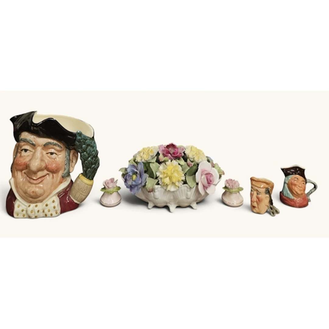A Royal Doulton Toby Jug 'Mine Host' along with other miniat...