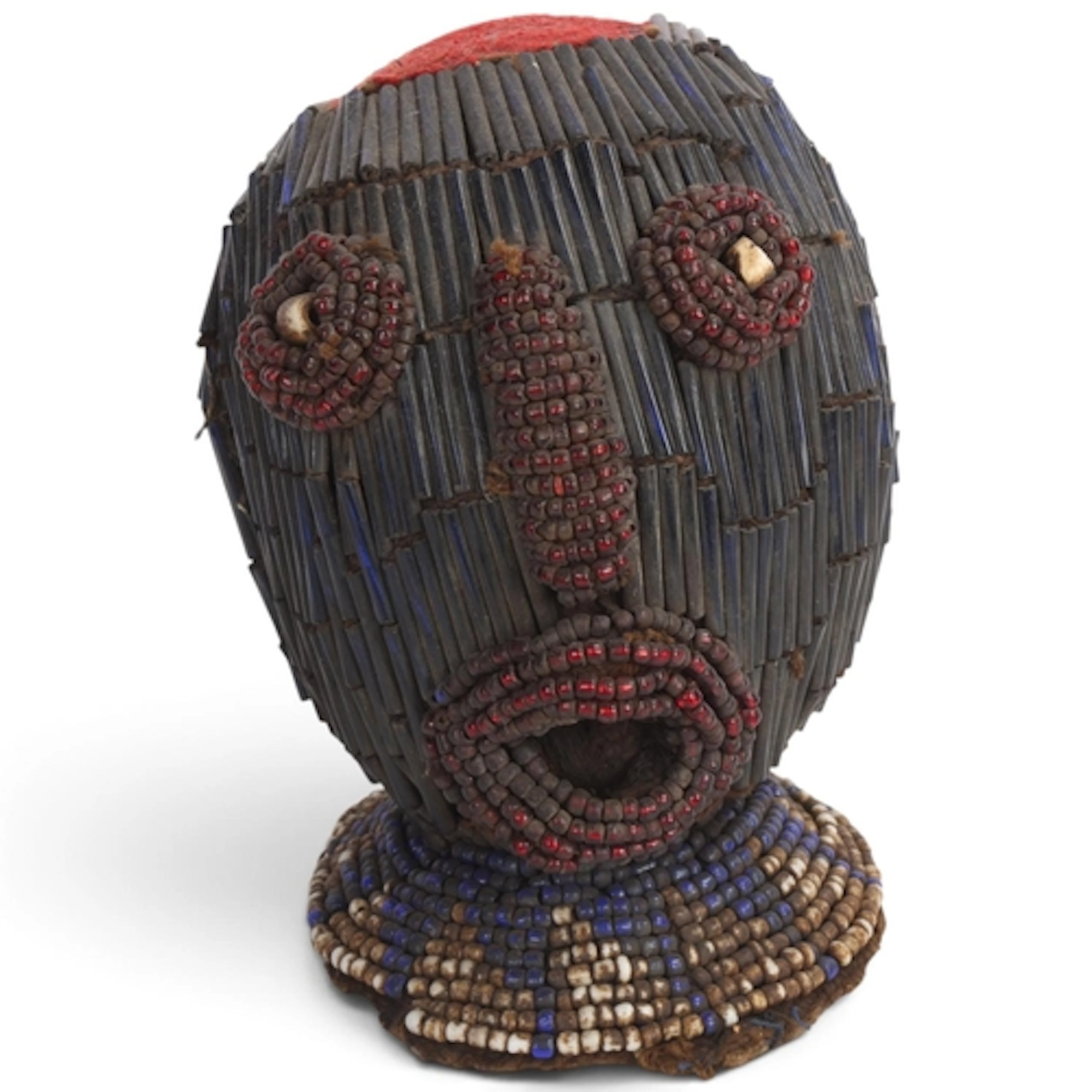 A Bamileke beaded anthropomorphic trophy head, Cameroon Gras...