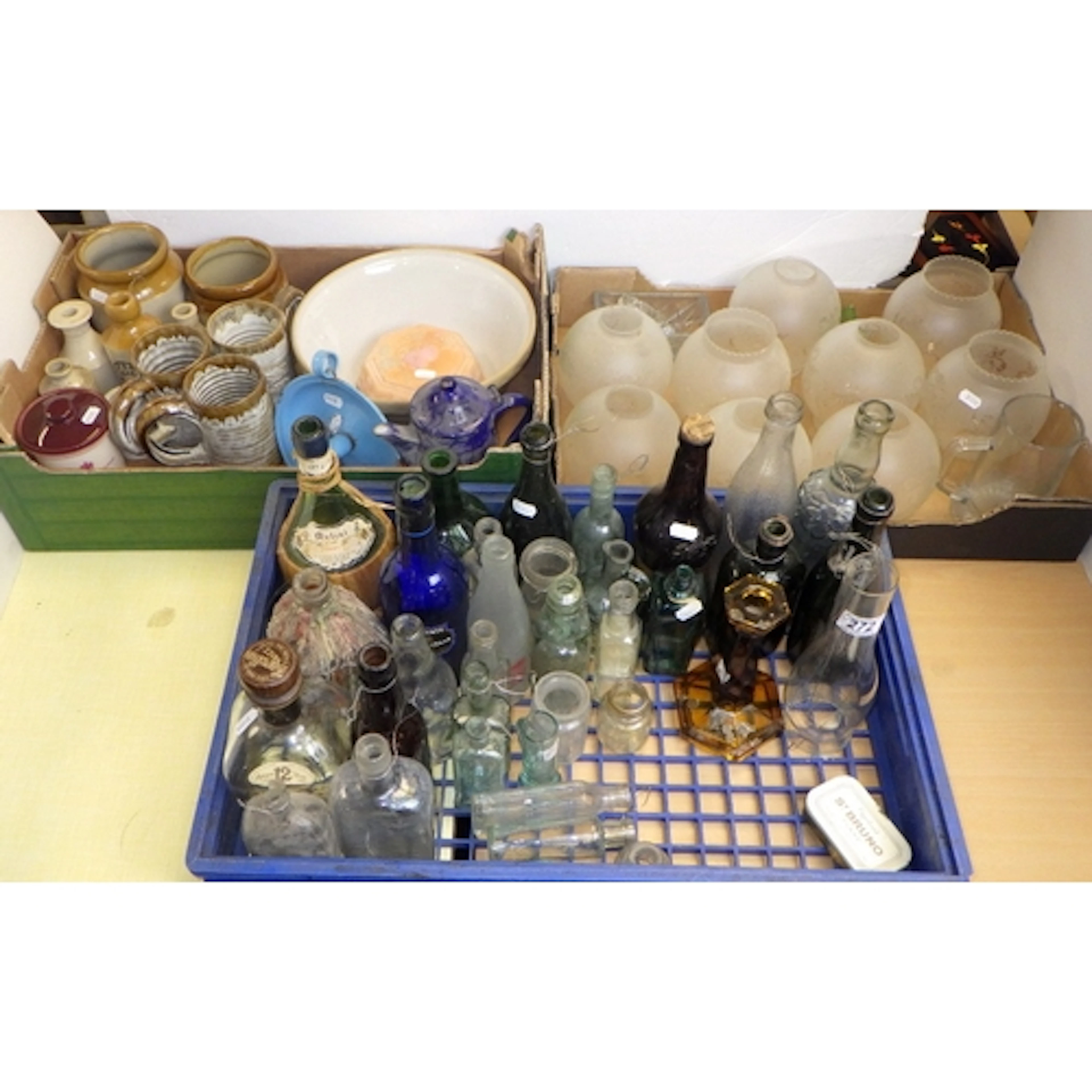 A qty of glass bottles, stoneware, lamp shades etc (3)