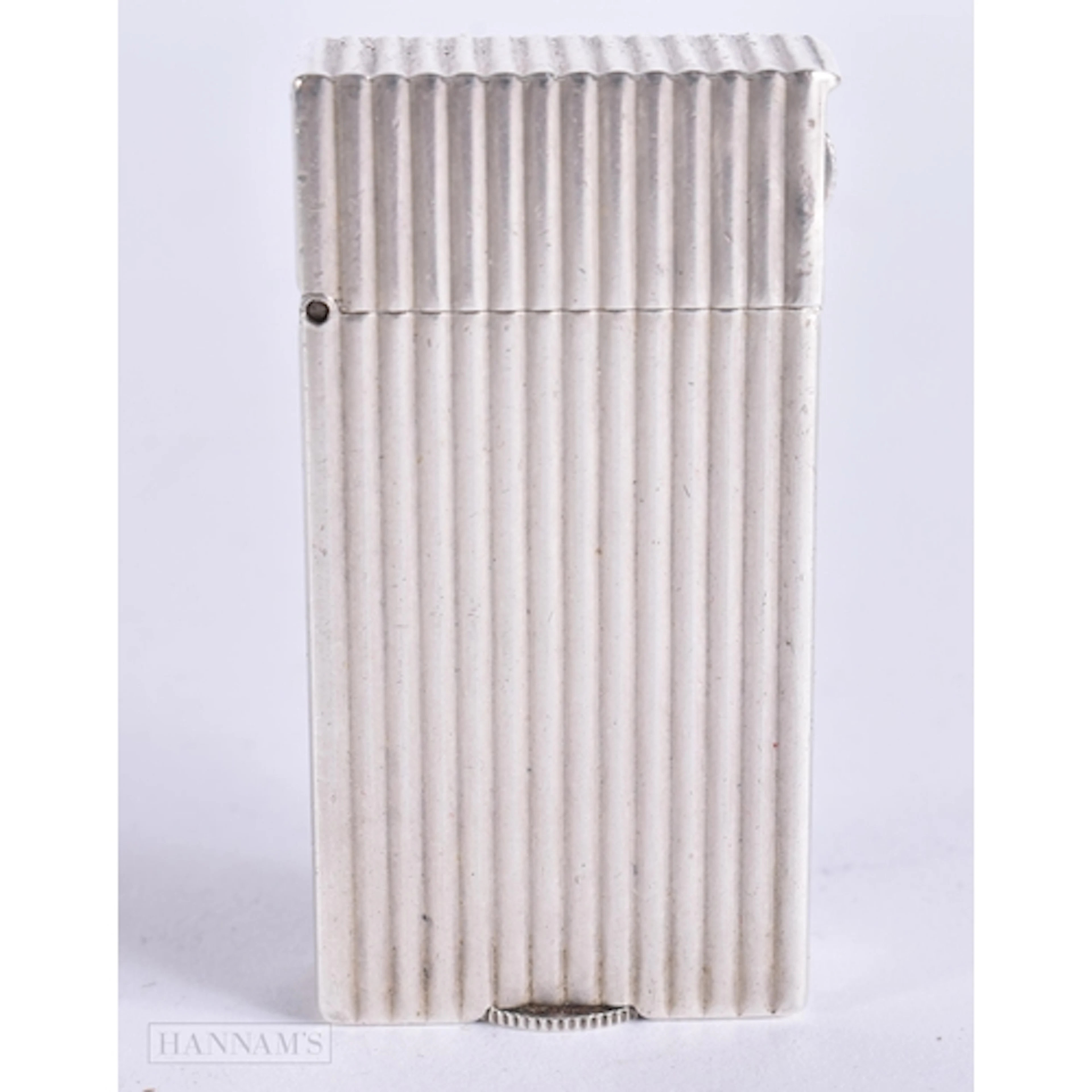 AN ART DECO FRENCH HERMES SILVER LIGHTER. 5.5 cm high.