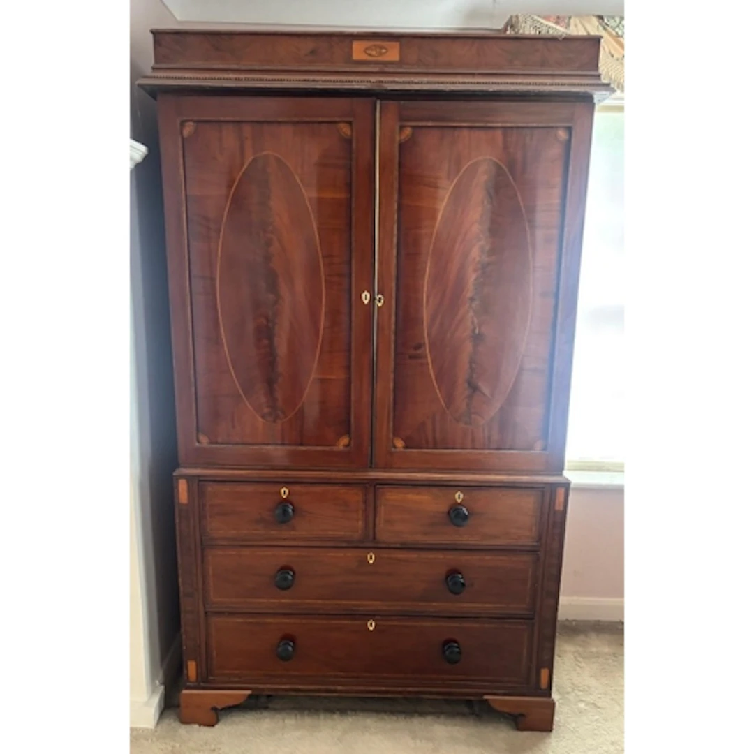 A flame mahogany linen press comprising of a two over two ch...
