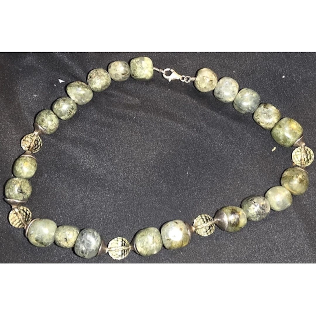 A Jade coloured and white metal necklace