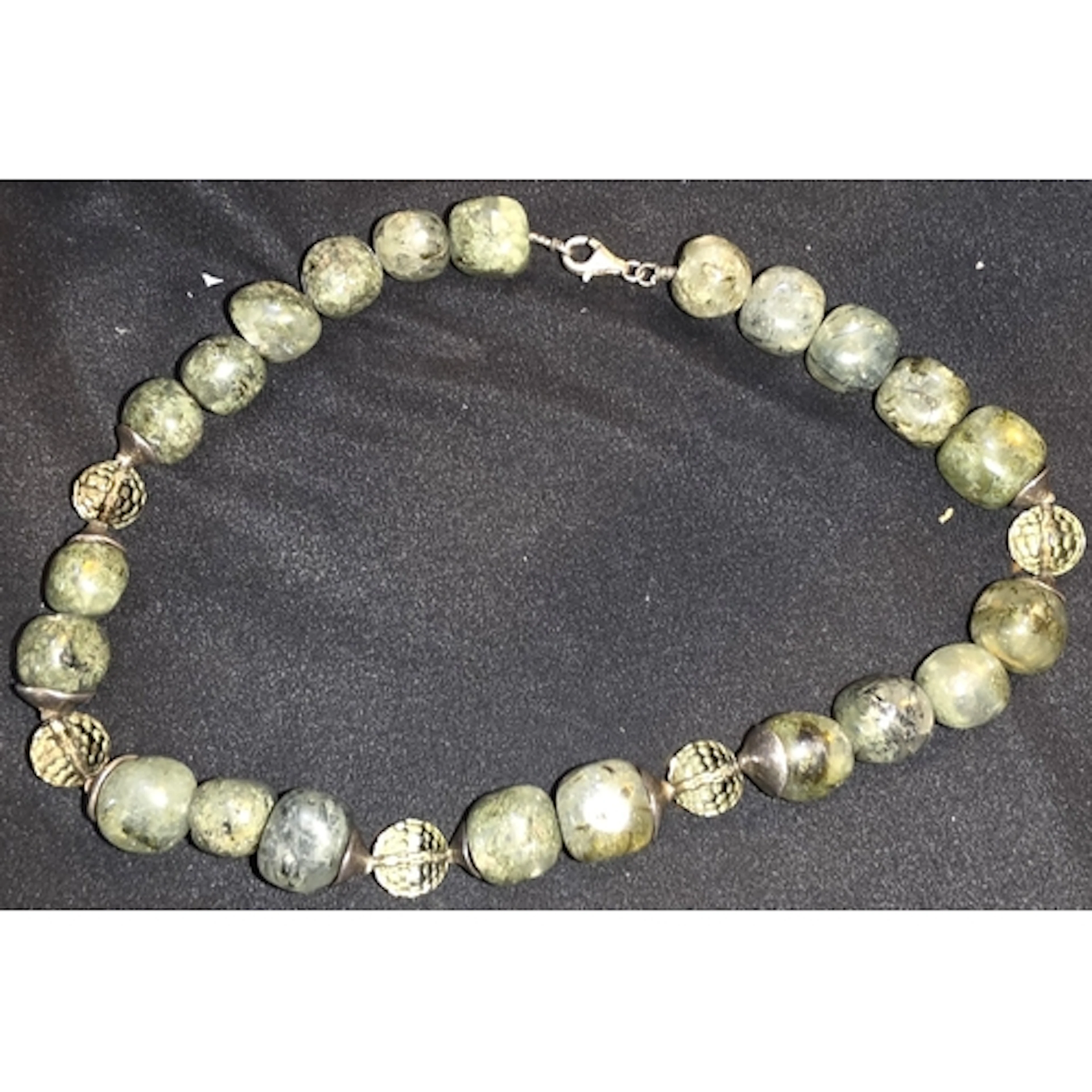 A Jade coloured and white metal necklace