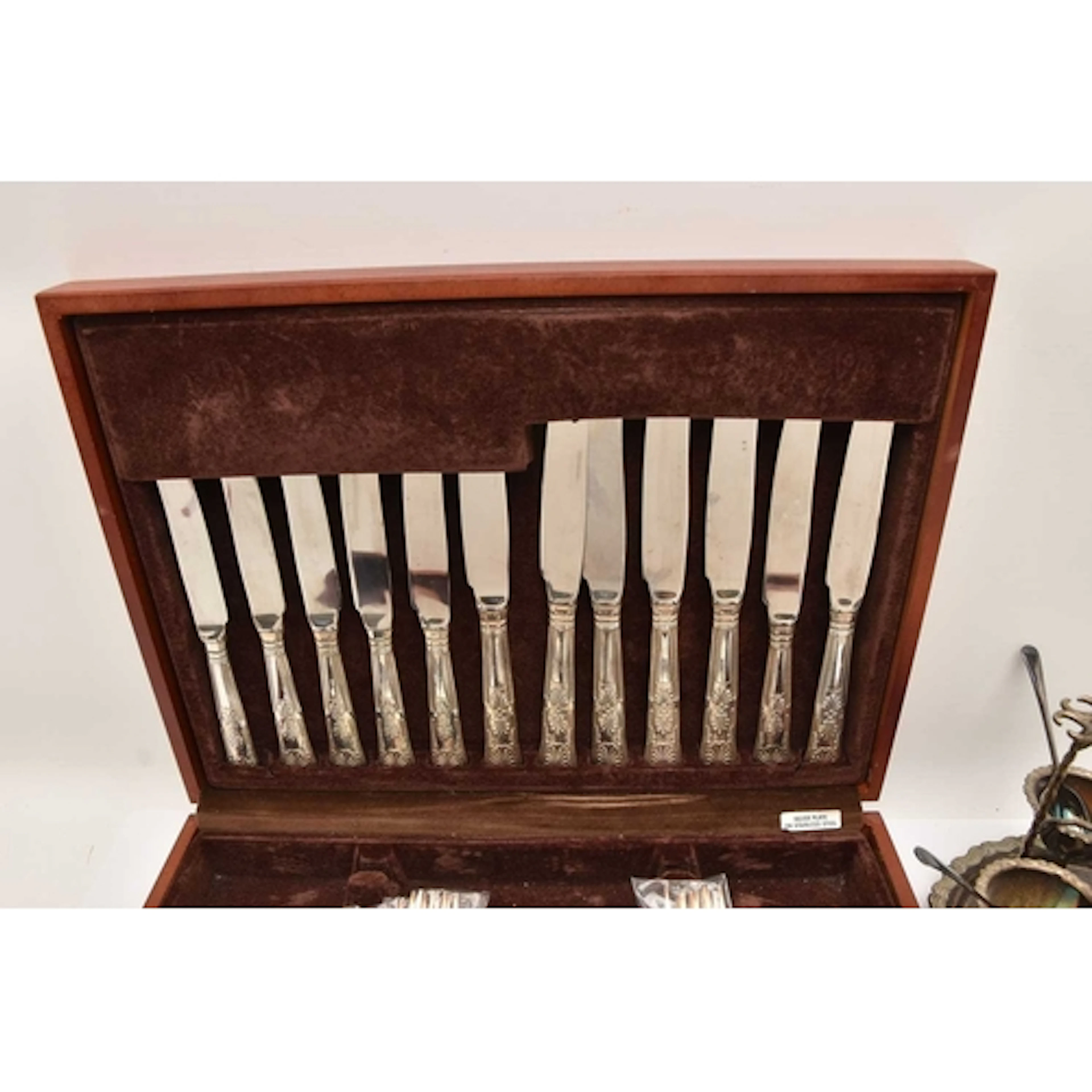 A CANTEEN OF CUTLERY AND SILVER PLATED EGG CUP STAND, wooden...
