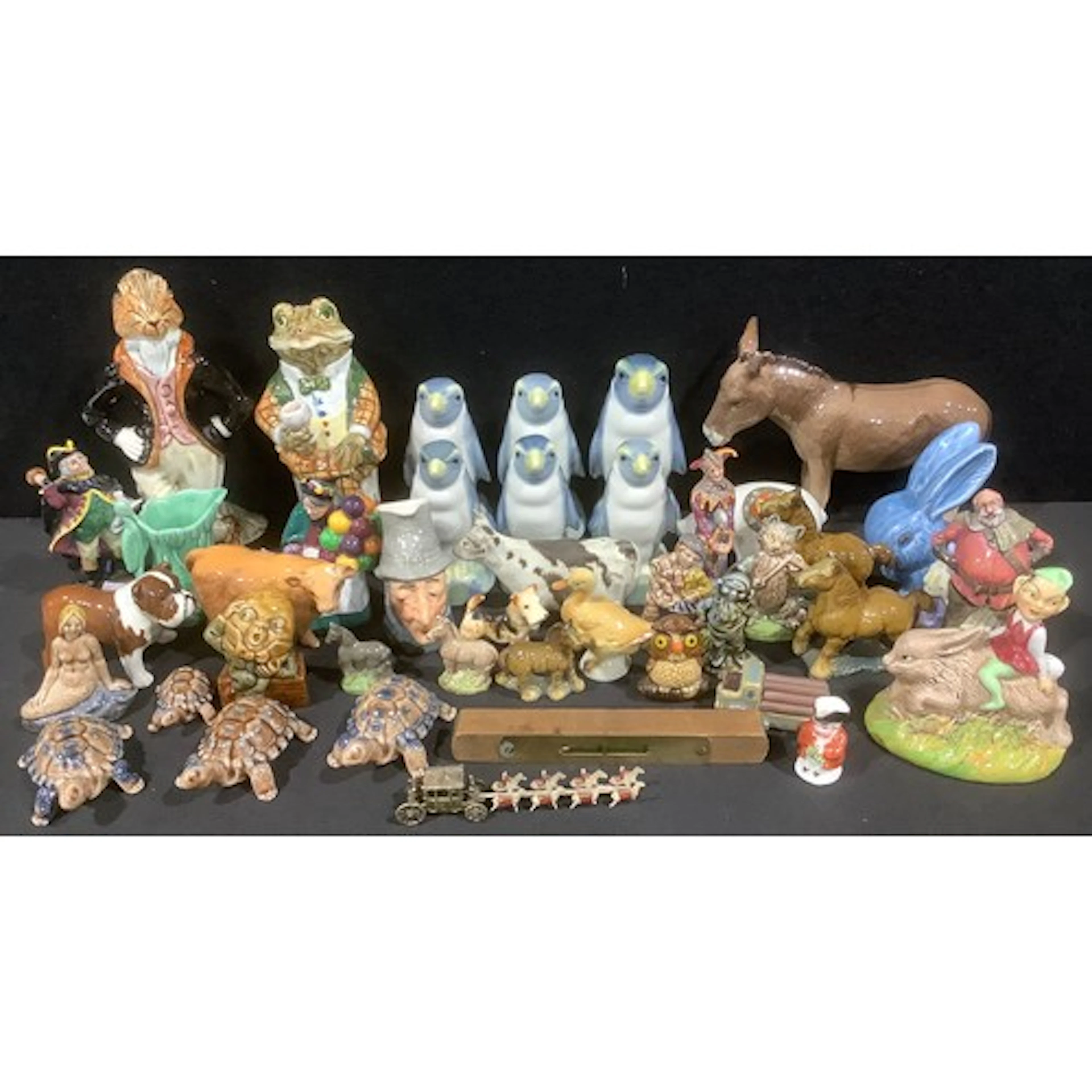 A Beswick model donkey, a calf and a bulldog; a set of four ...