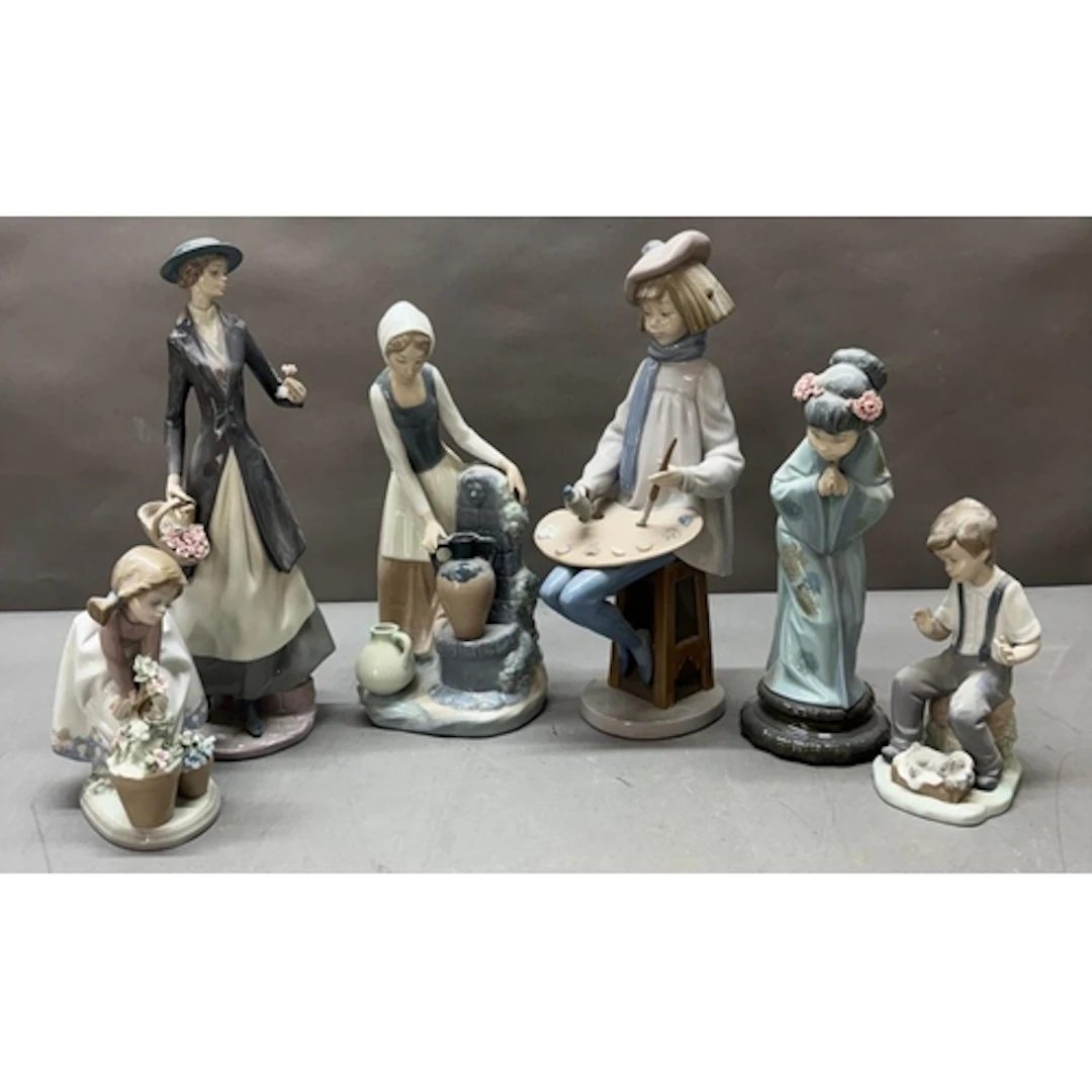 A selection of Lladro and NAO figures to include artist, Gei...