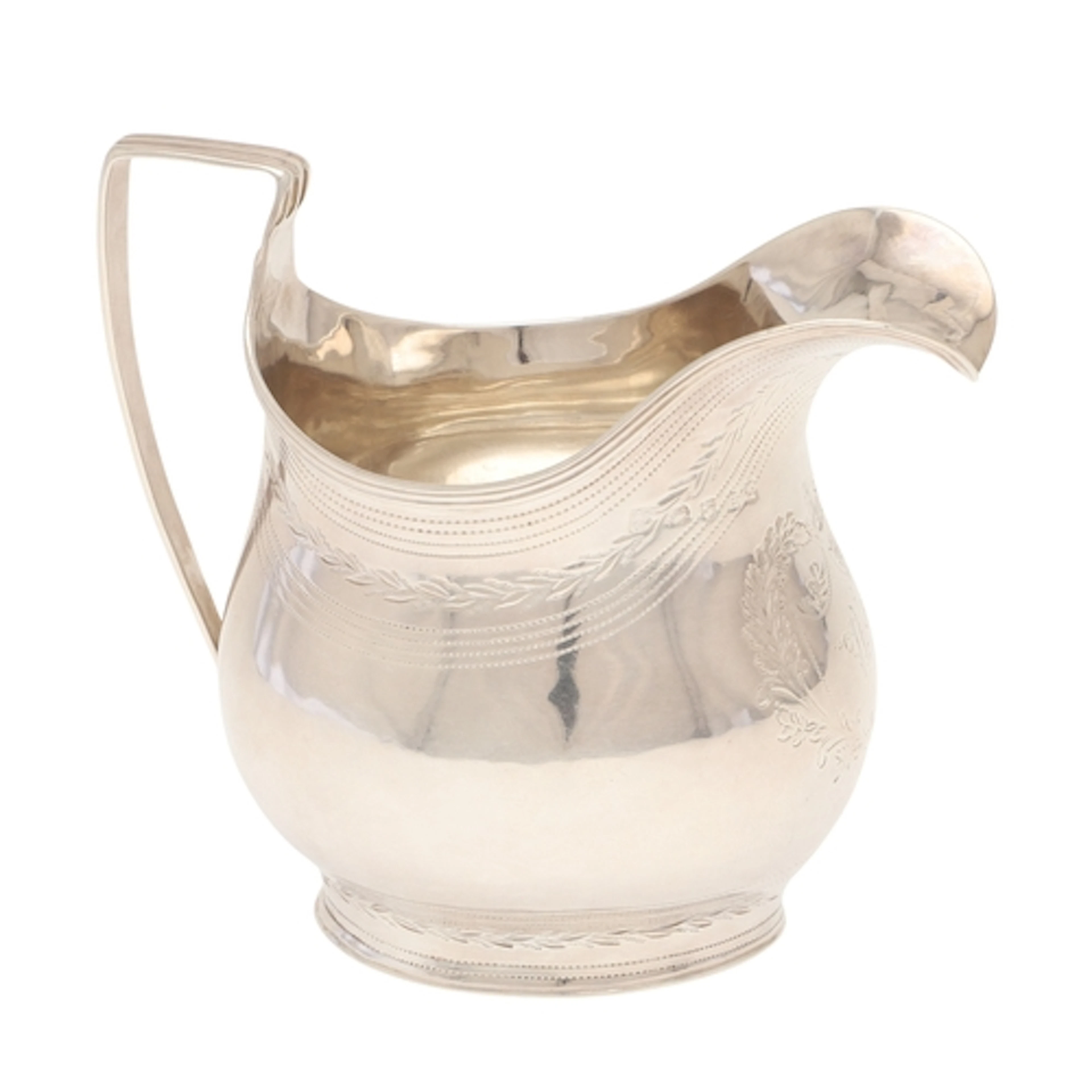 A GEORGE III SILVER HELMET SHAPED CREAM JUG. With pricked an...
