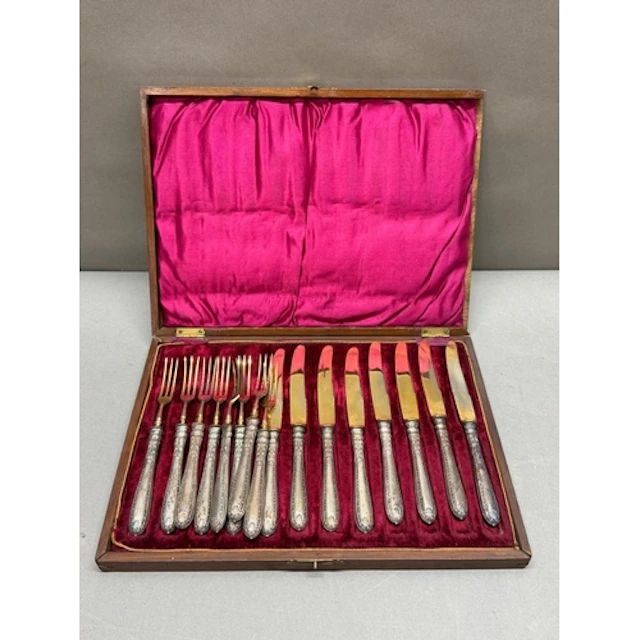 A Continental silver eight place setting of dessert knives a...