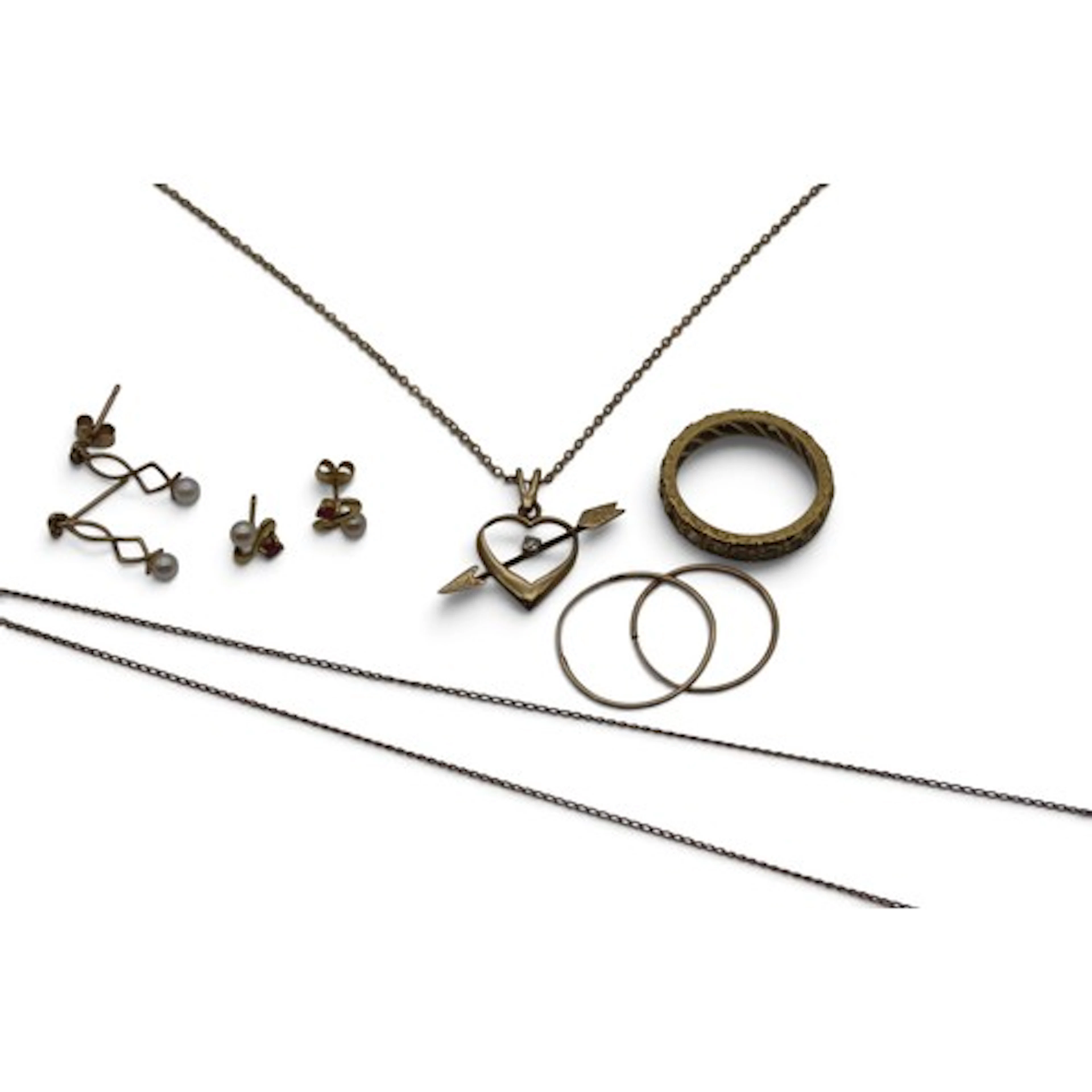 A 9ct gold Cupid's arrow pendant, set with a diamond, on a f...