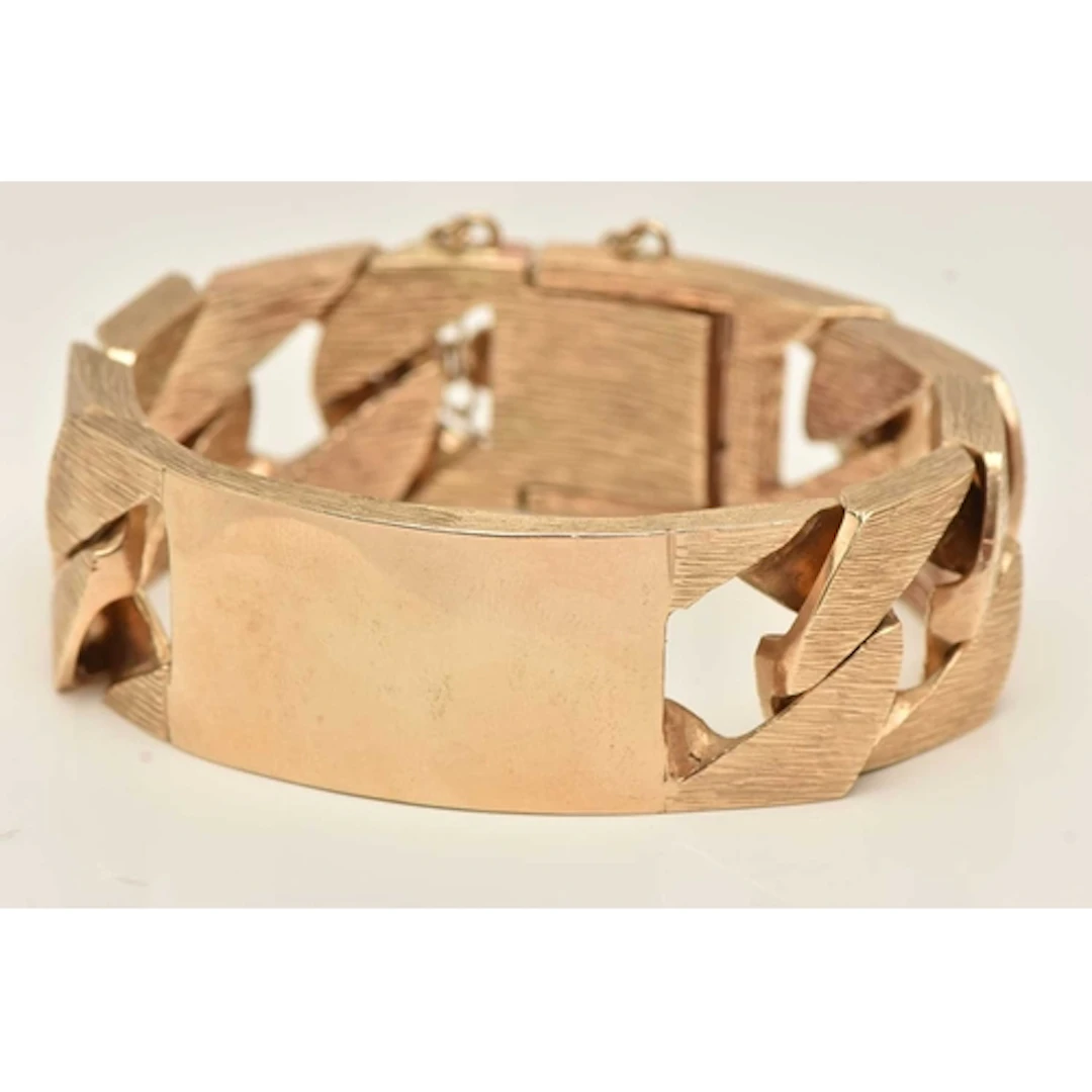 A HEAVY 9CT GOLD CURB LINK IDENTIFICATION BRACELET, polished...