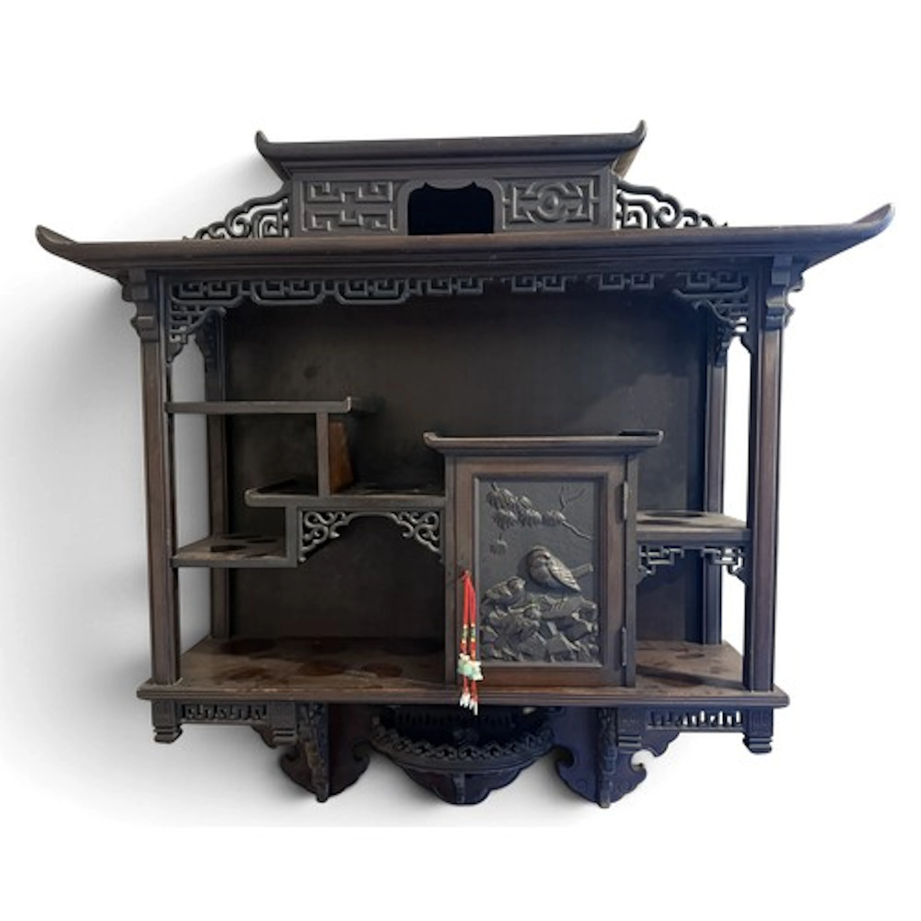 An oriental carved wooden wall cabinet. 66.5 w x 25 d x 71cm...
