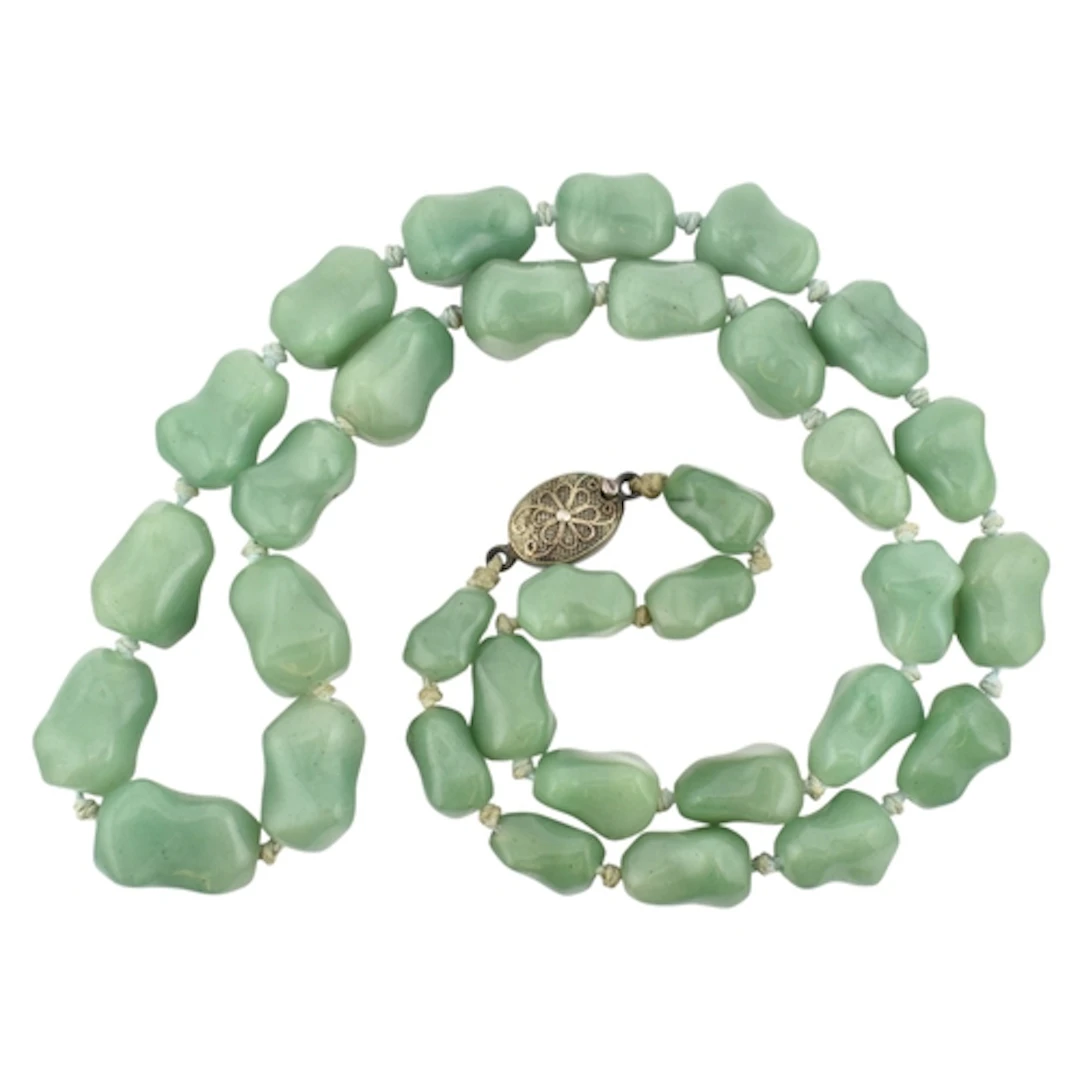 Green aventurine bead necklace with silver clasp. Clasp stam...