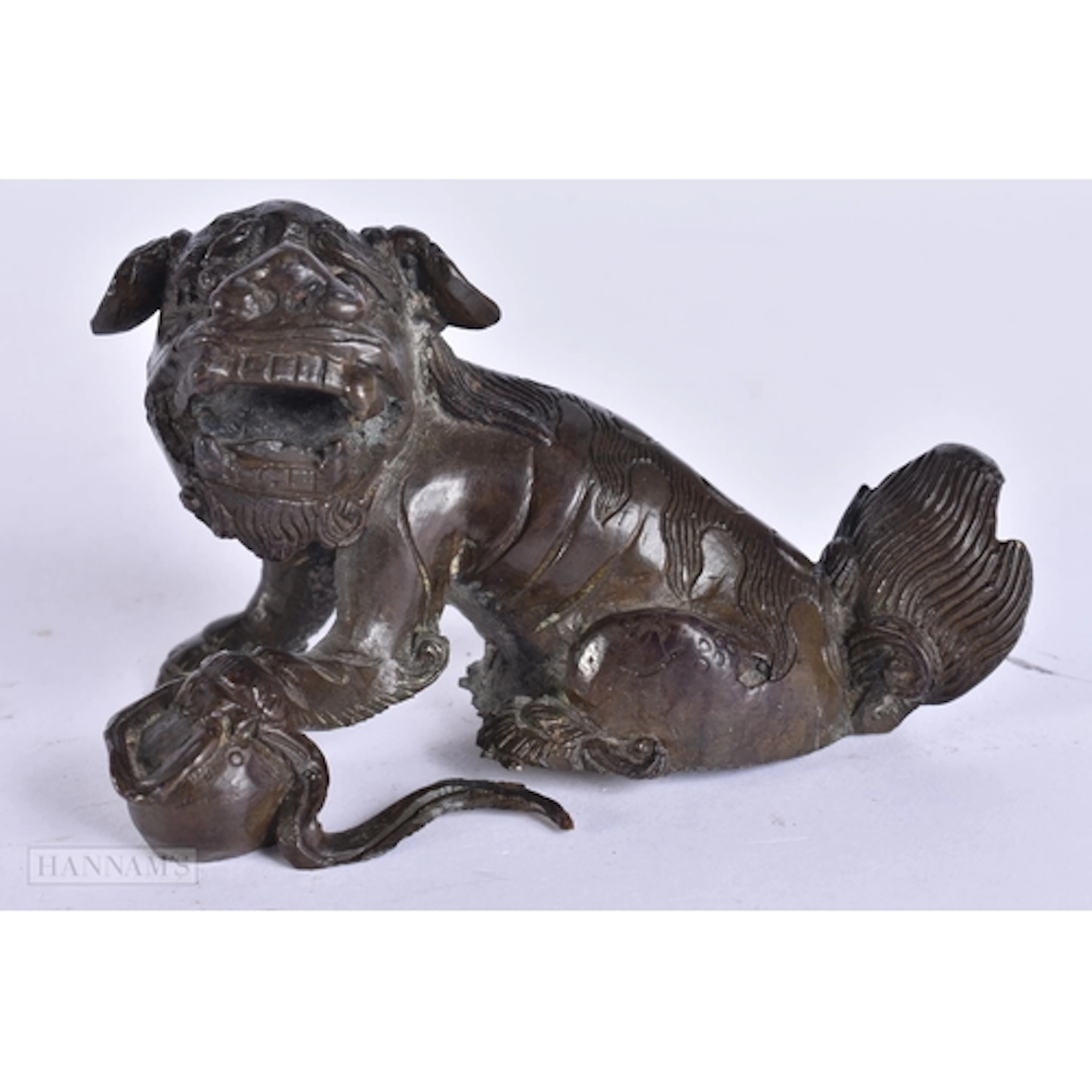 A 17TH/18TH CENTURY CHINESE BRONZE BUDDHISTIC LION Ming/Earl...