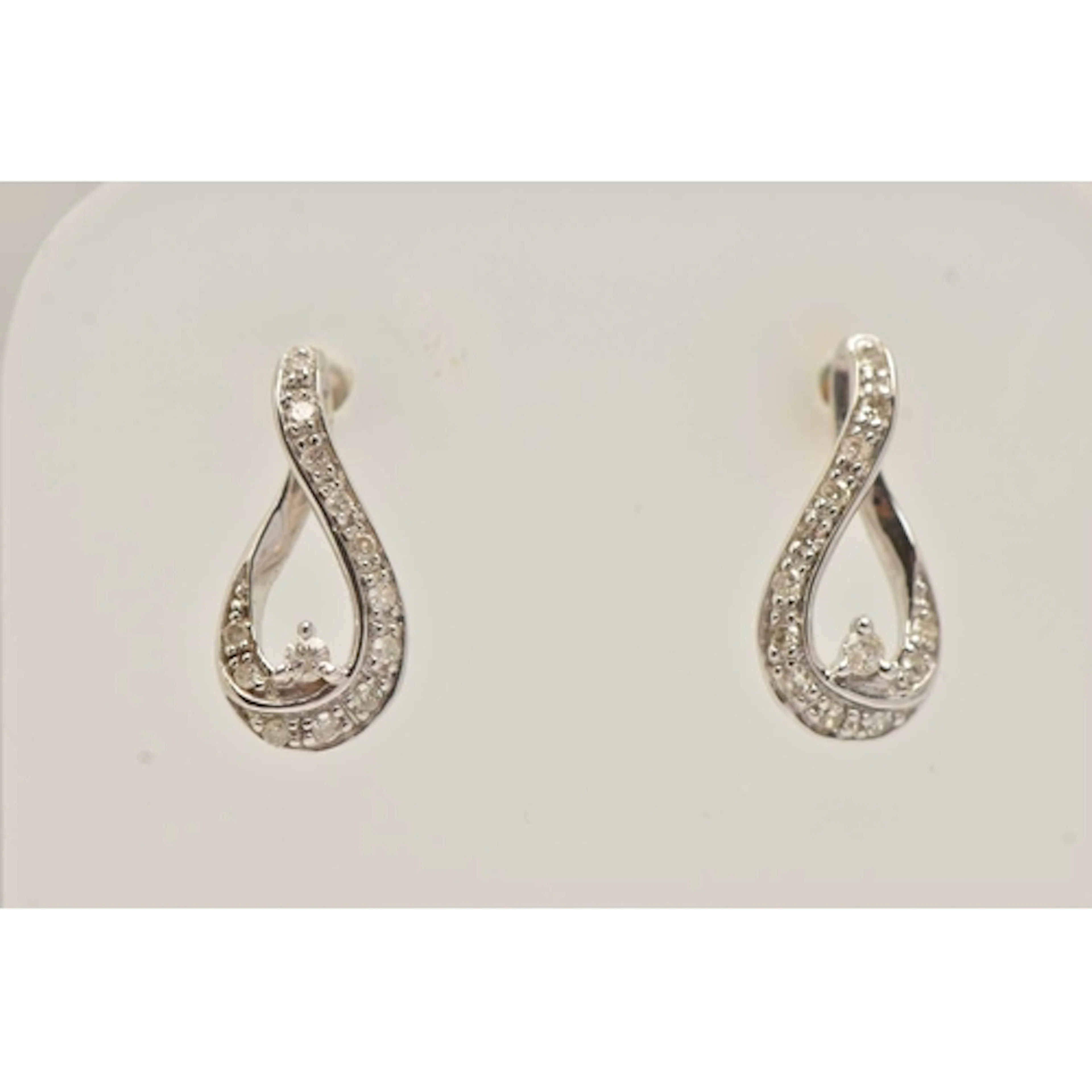 A PAIR OF 9CT WHITE GOLD DIAMOND EARRINGS, open work drop ea...