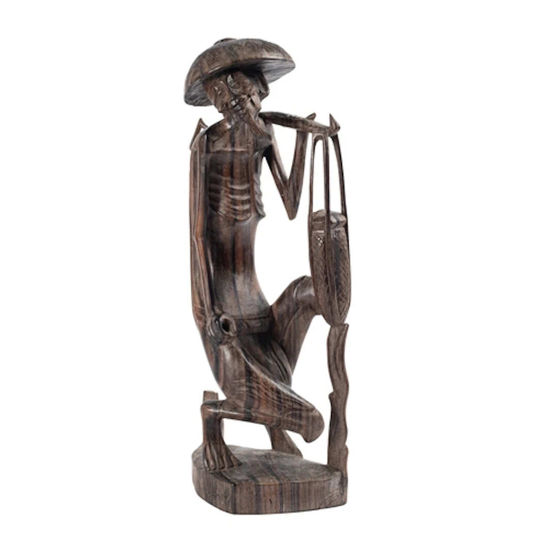 A South East Asian carved hardwood figure of a farmer, 30cm.