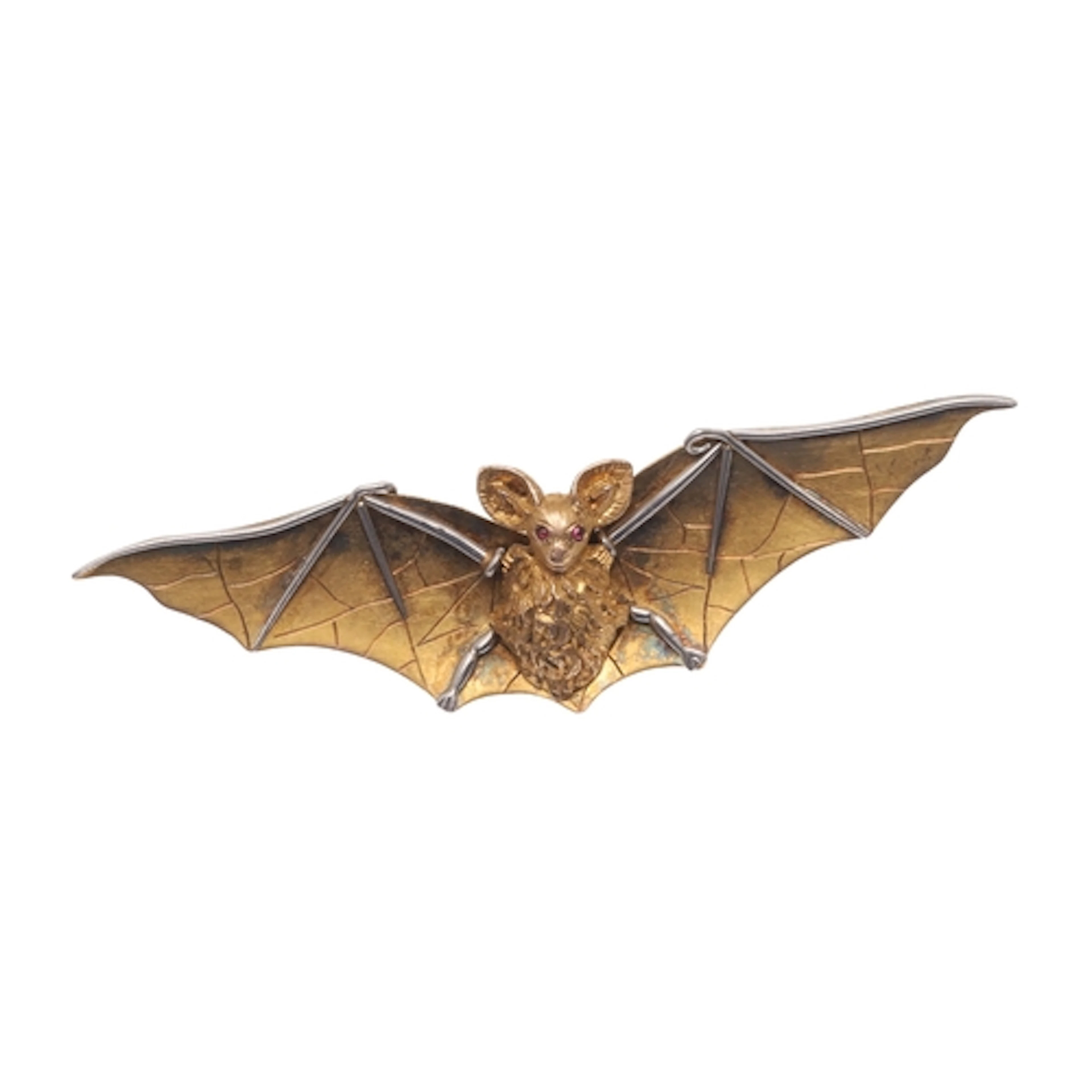 A GOLD BAT BROOCH. depicting a bat in full flight, with cabo...