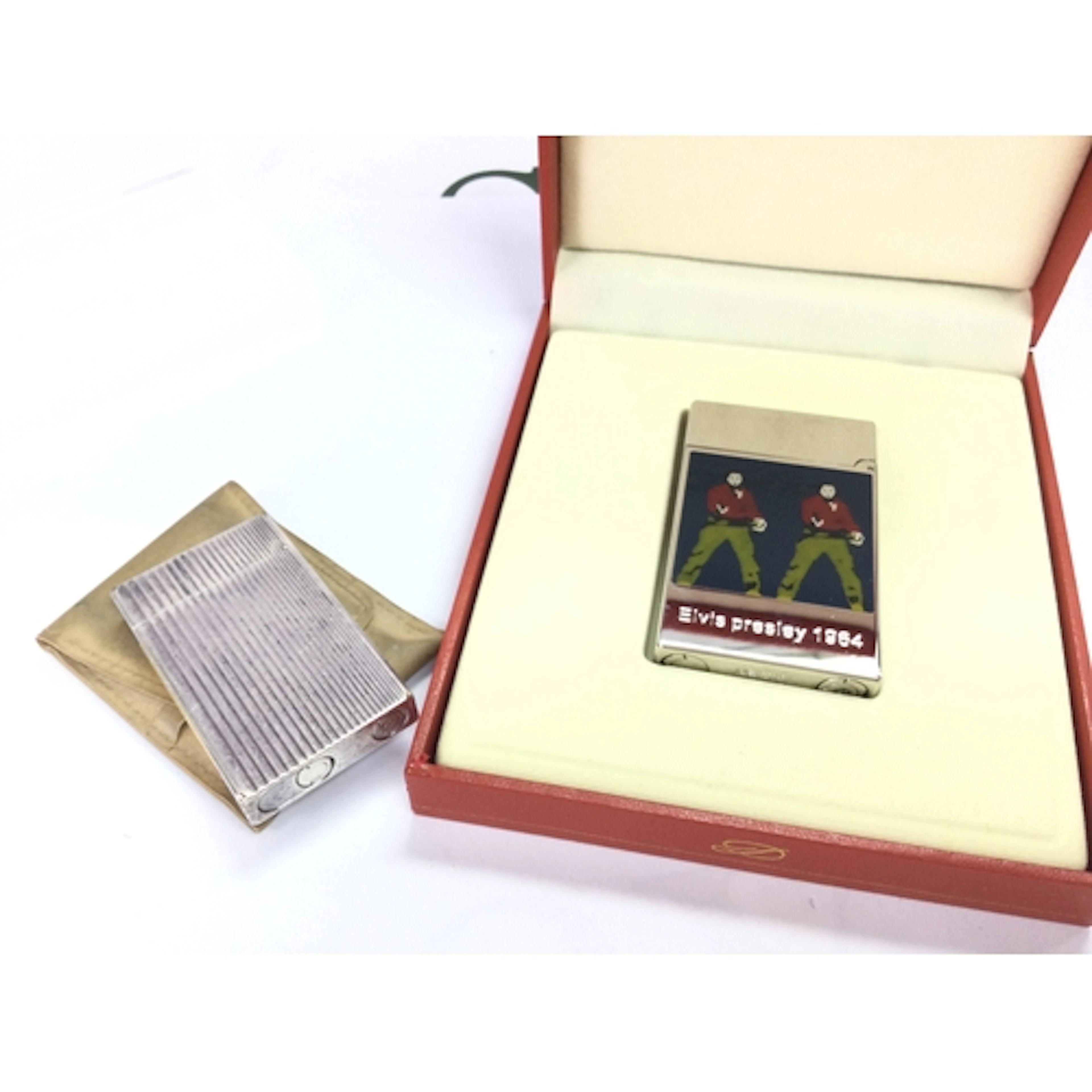 A cased DuPont Elvis Presley 1964 Andy Warhol lighter and an...