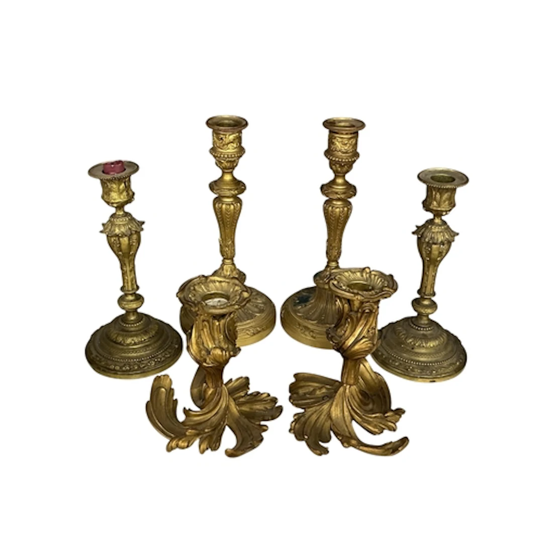 A pair of Empire style ormolu candlesticks (drilled bases) h...