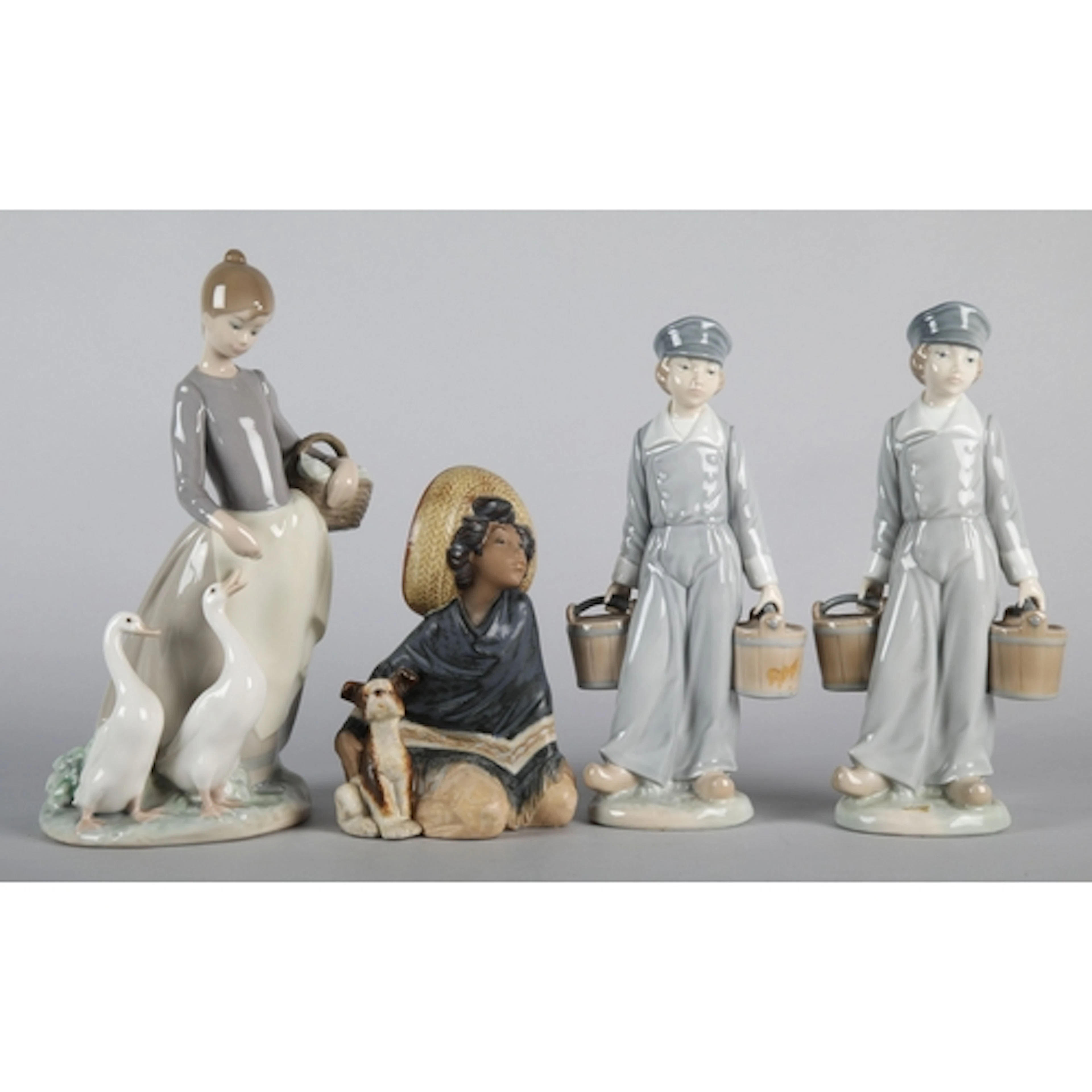 Collection of four Lladro figures. (4)