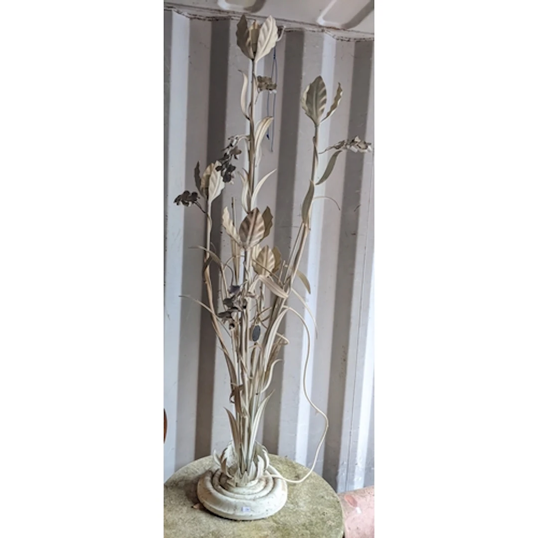 A vintage cast metal floor standing lamp of floral form, rai...