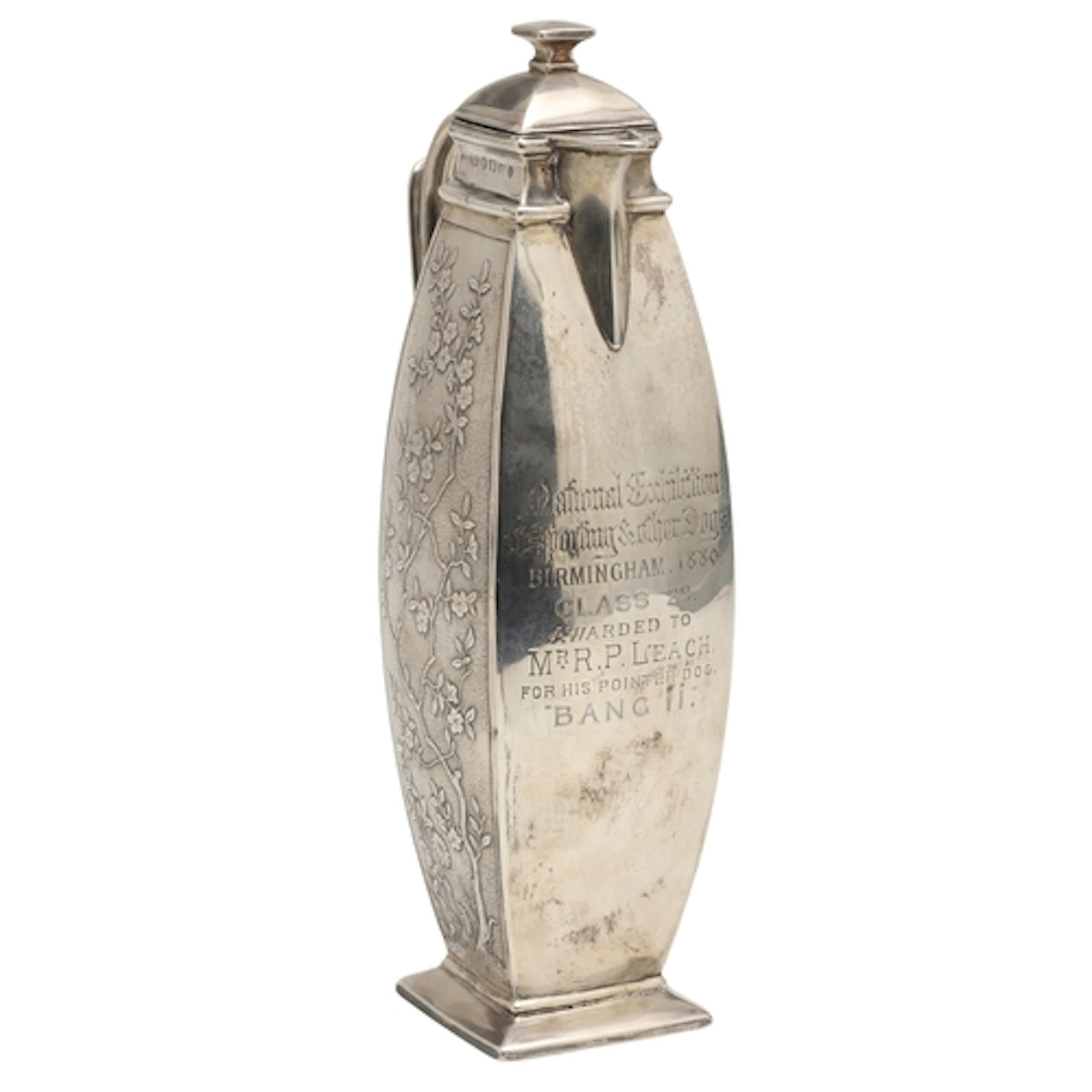 A VICTORIAN JAPANESQUE SILVER COFFEE POT. With two side pane...