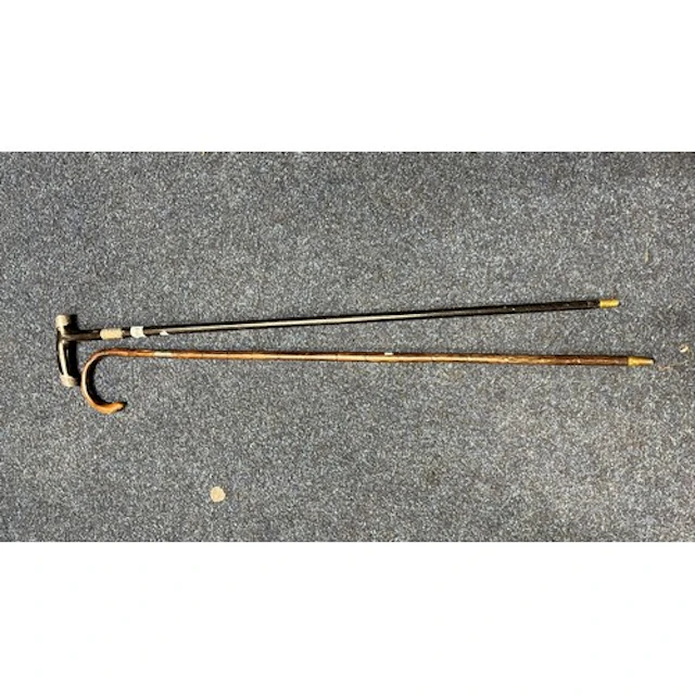 Silver collared walking stick and another silver topped and ...