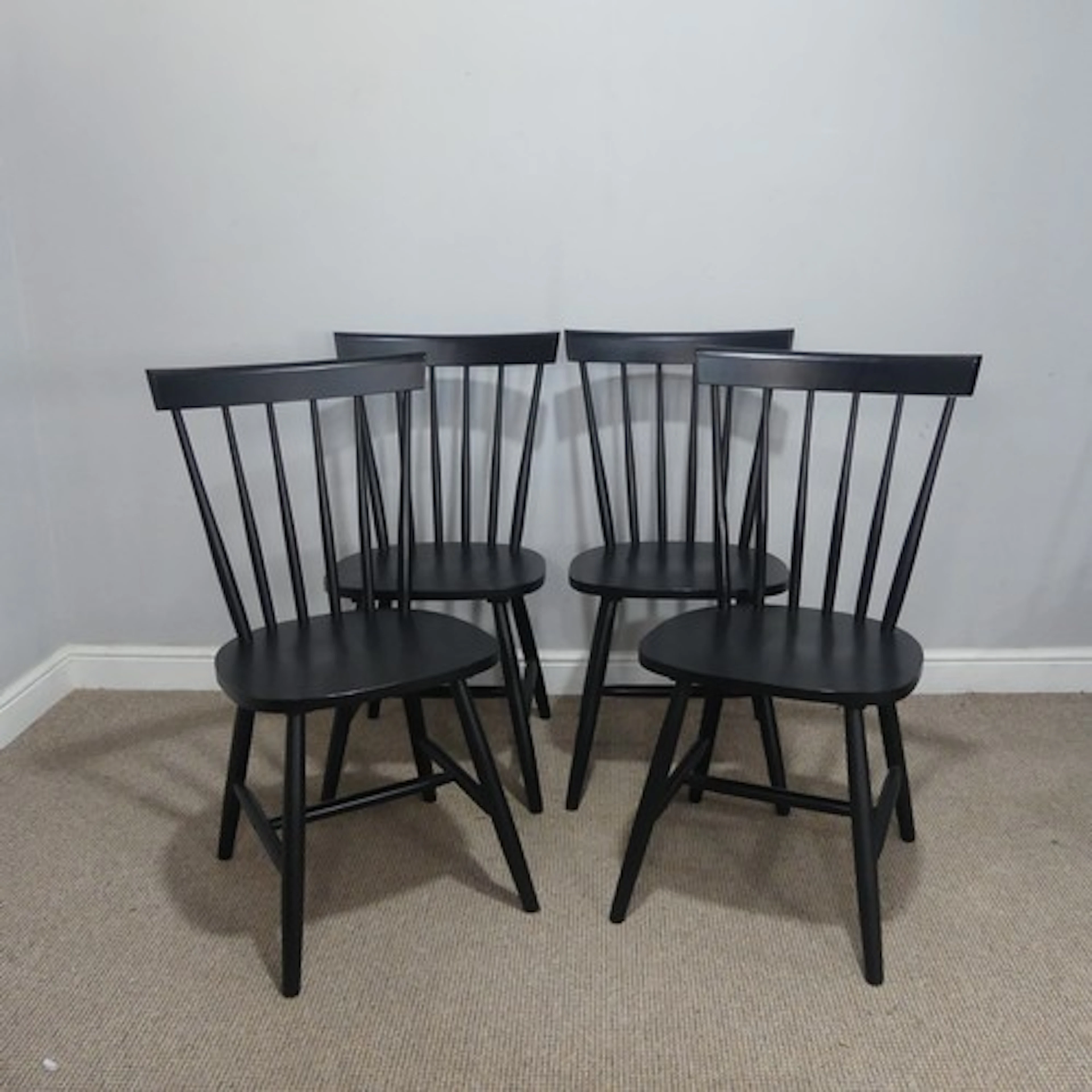 A set of four Contemporary ebonised dining Chairs, probably ...
