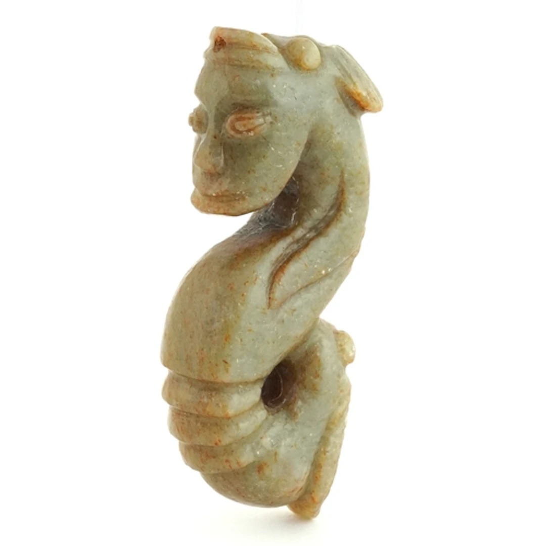 Chinese green stone carving of a mythical figure, 9.5cm in l...