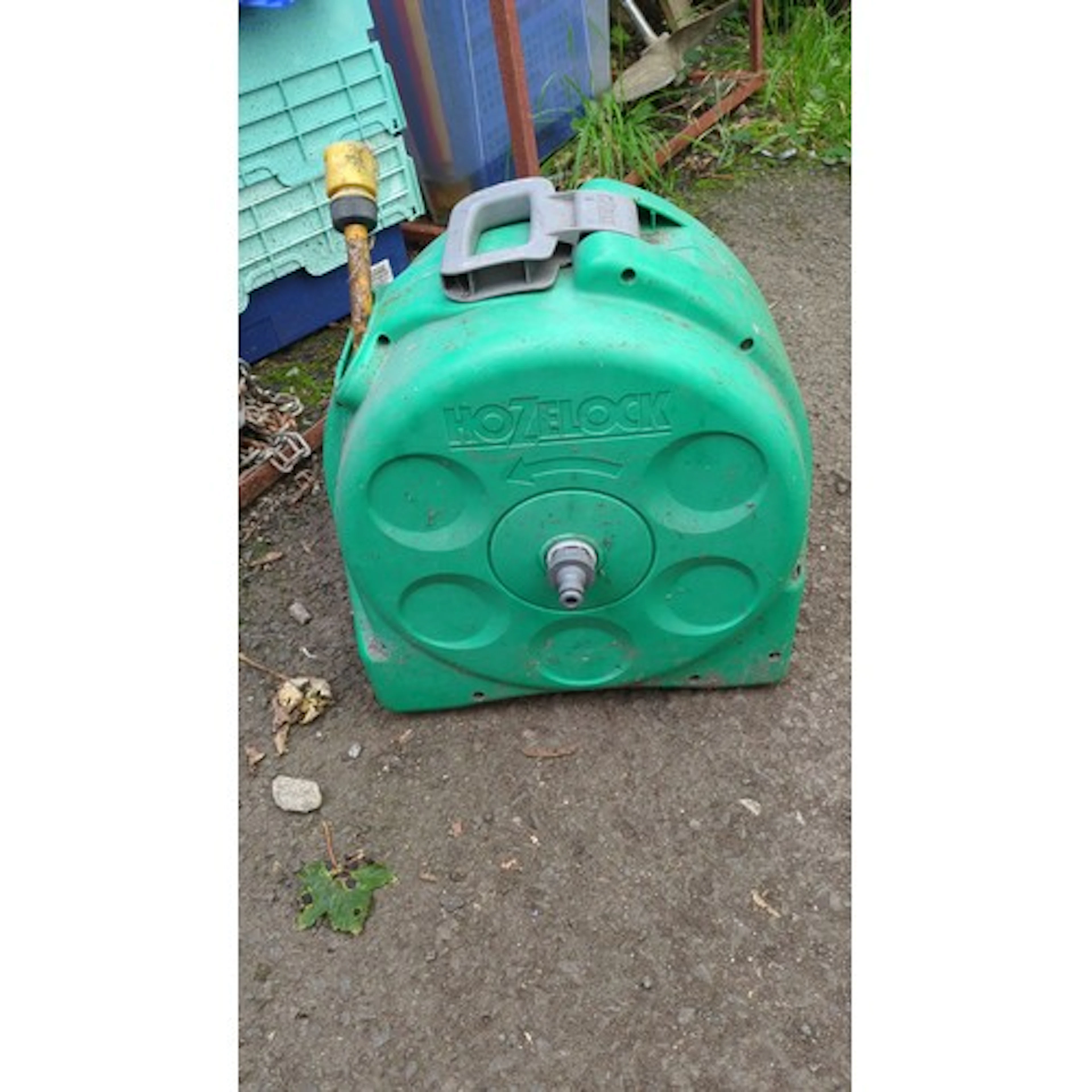 Hozelock enclosed portable hose reel of moulded green plasti...