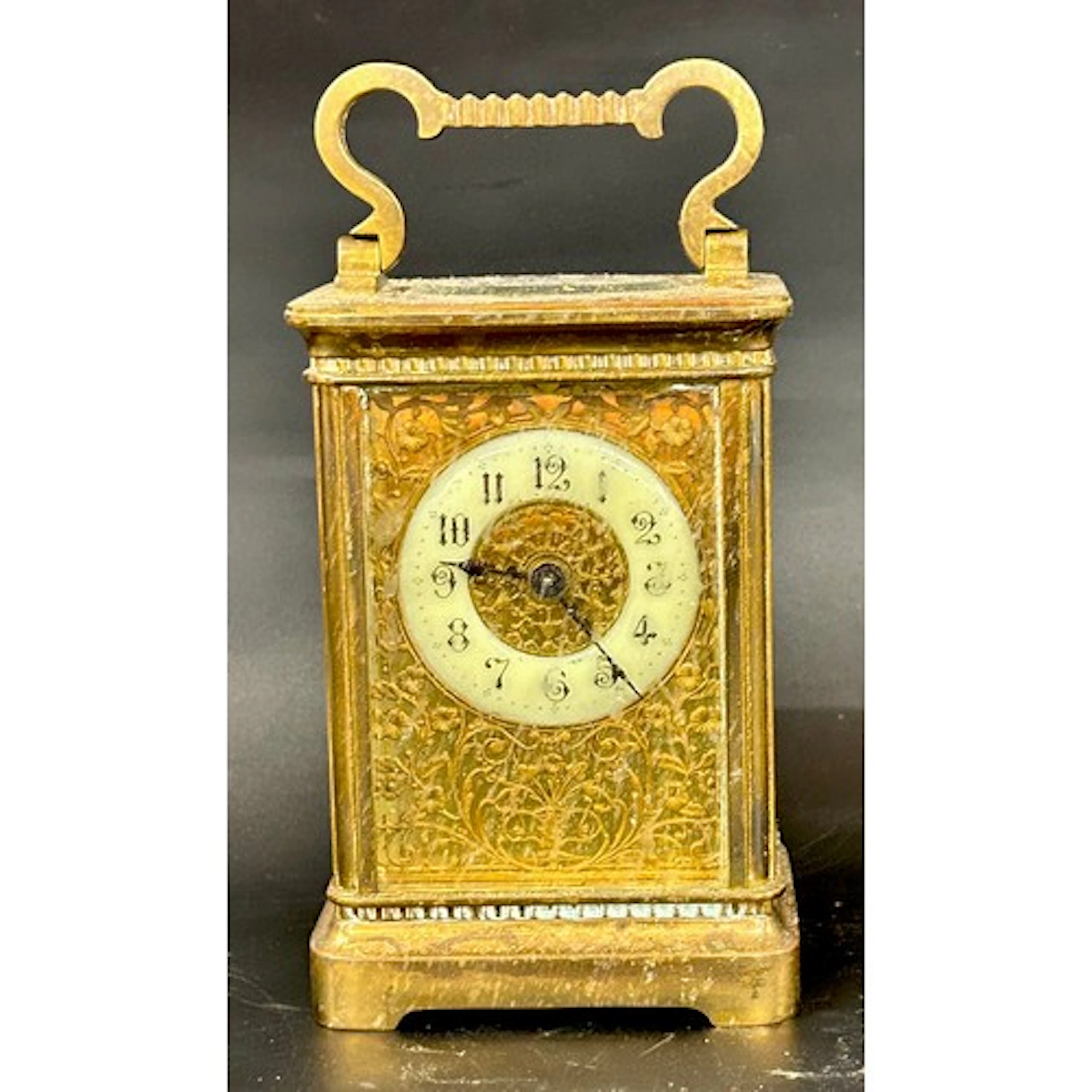 An early 20th Century brass carriage clock with enamel face ...