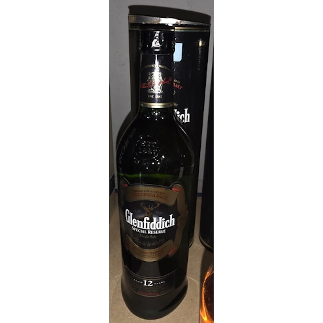 A 1 litre bottle of 12 year old Glenfiddich single malt whis...