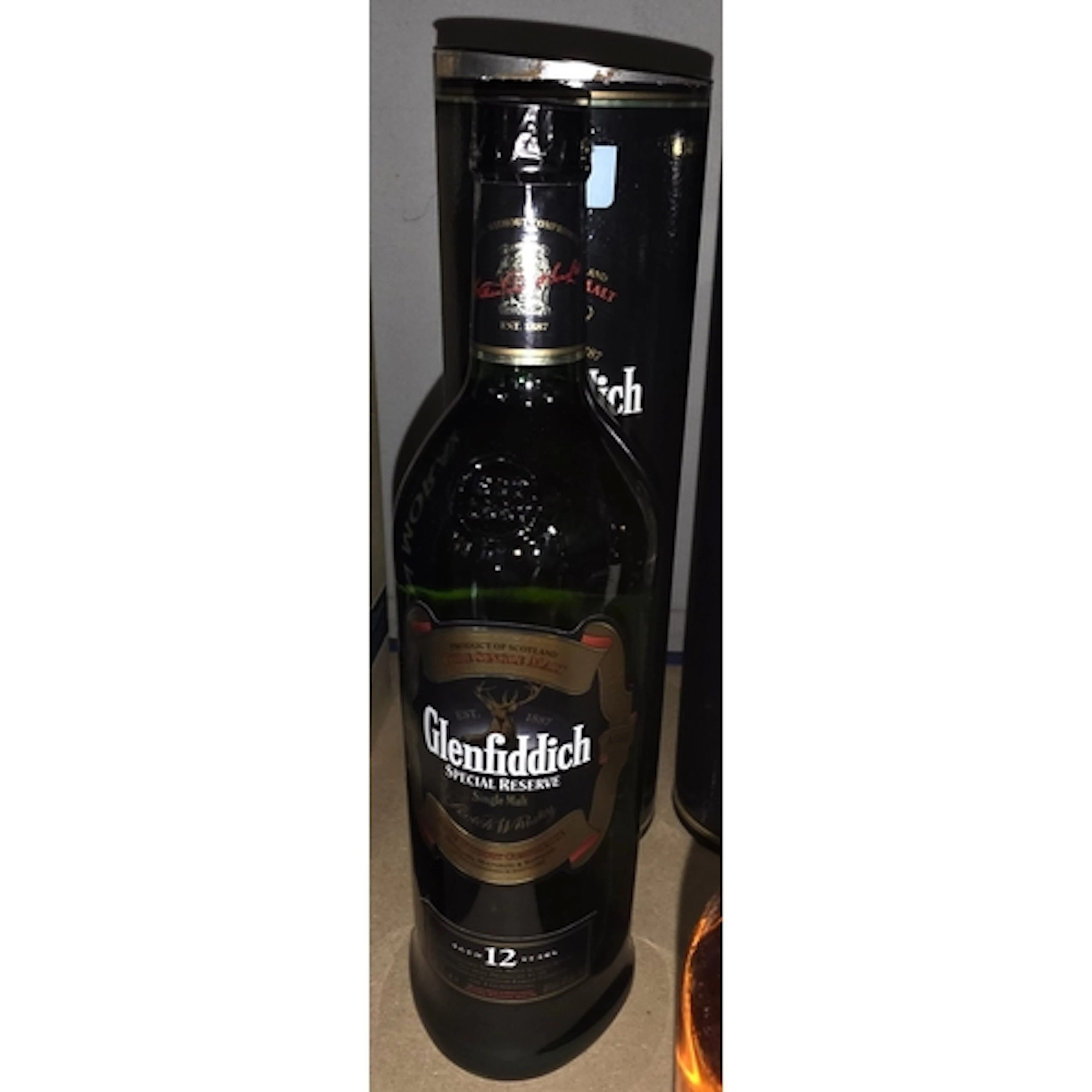 A 1 litre bottle of 12 year old Glenfiddich single malt whis...