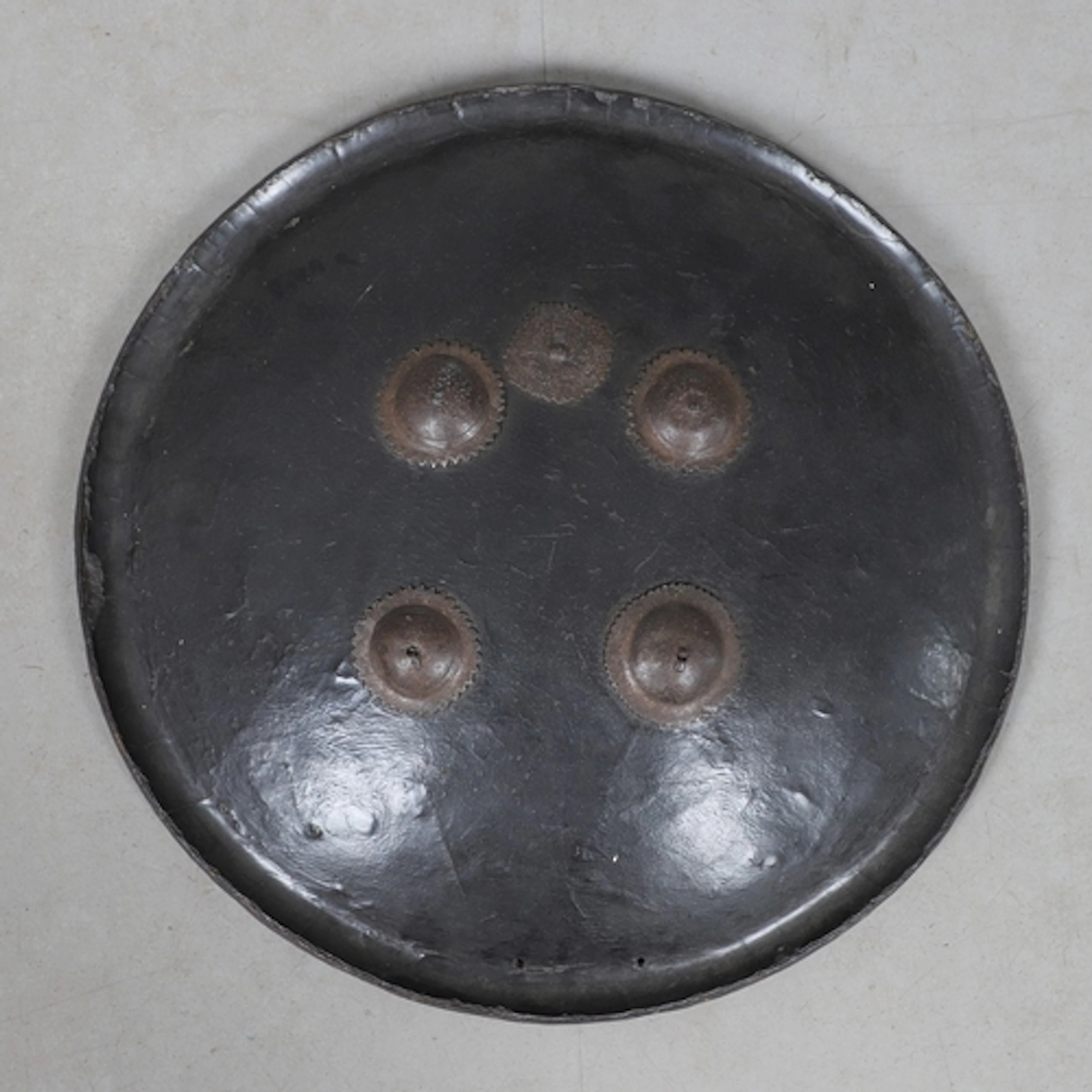 A 19TH CENTURY INDIAN 'DHAL' SHIELD. A large Indian painted ...