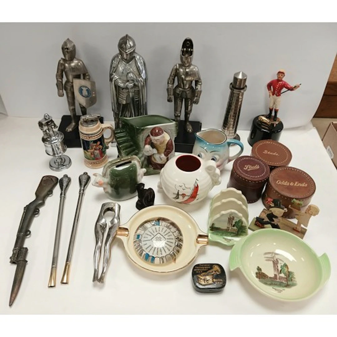 Three metal knight figures, two in the form of table lighter...