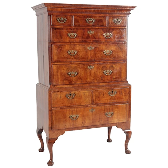 A George I figured walnut chest on stand, the moulded cornic...