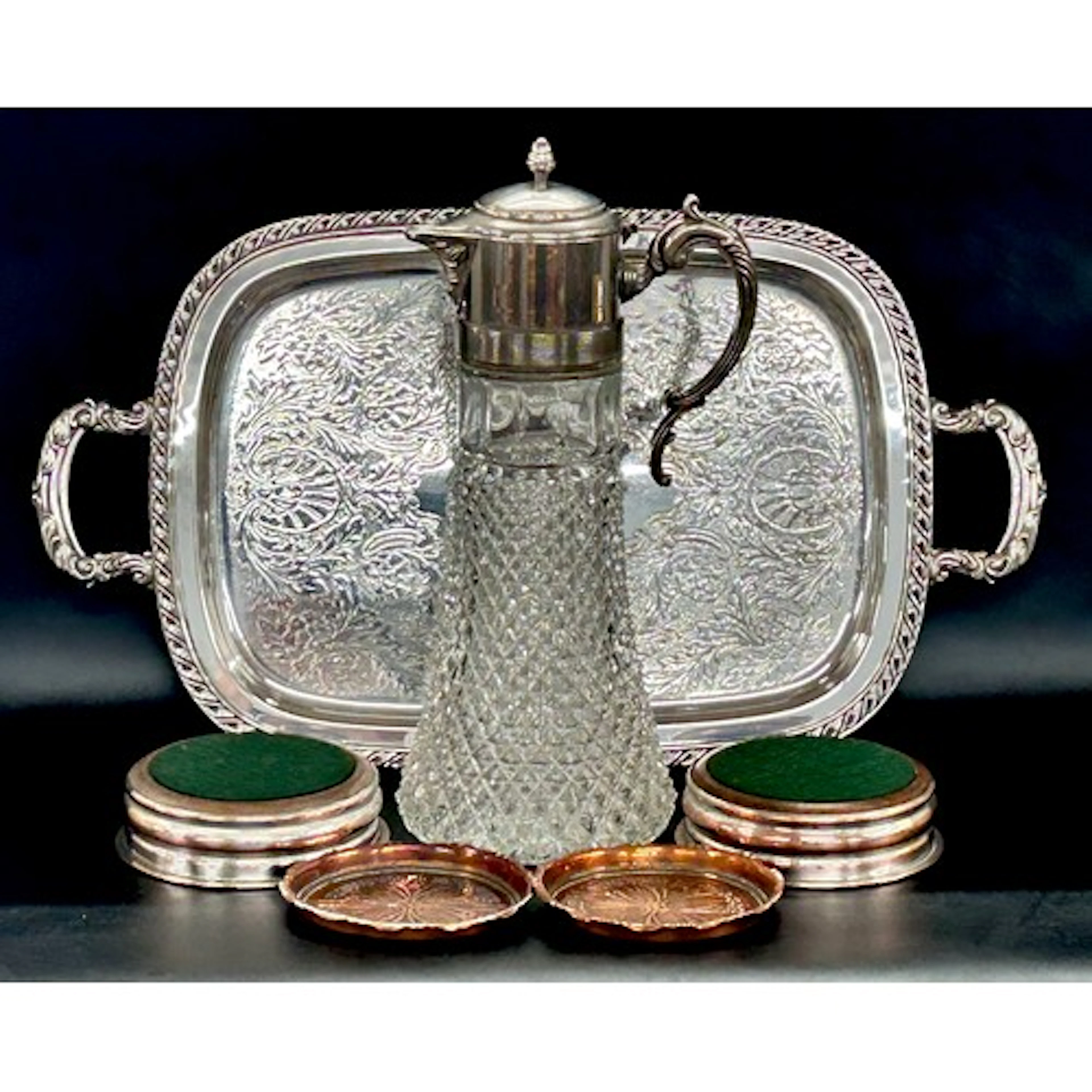 An Oneida silver plated tray, claret jug and a pair of Art N...