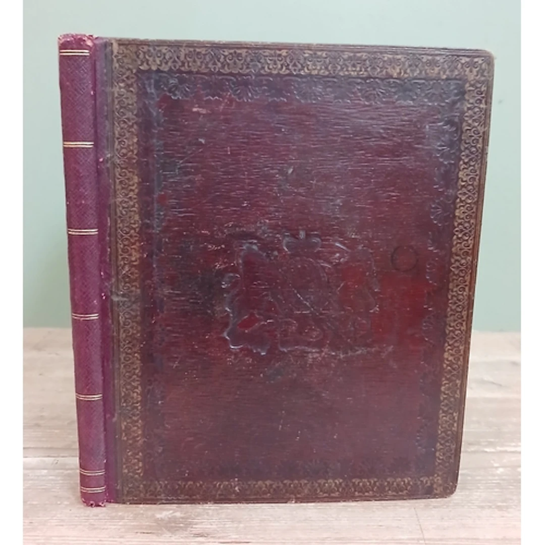 A Victorian gilt tooled Moroccan red leather album with embo...