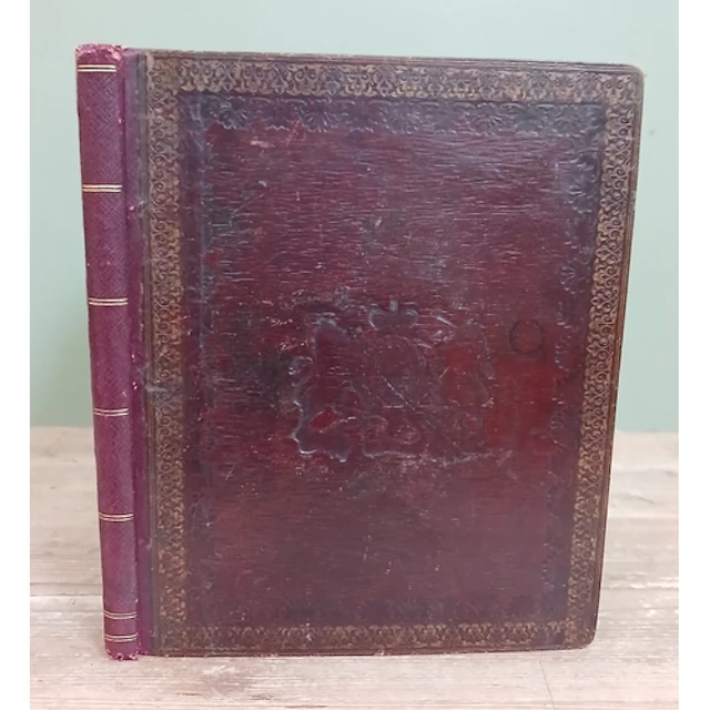A Victorian gilt tooled Moroccan red leather album with embo...