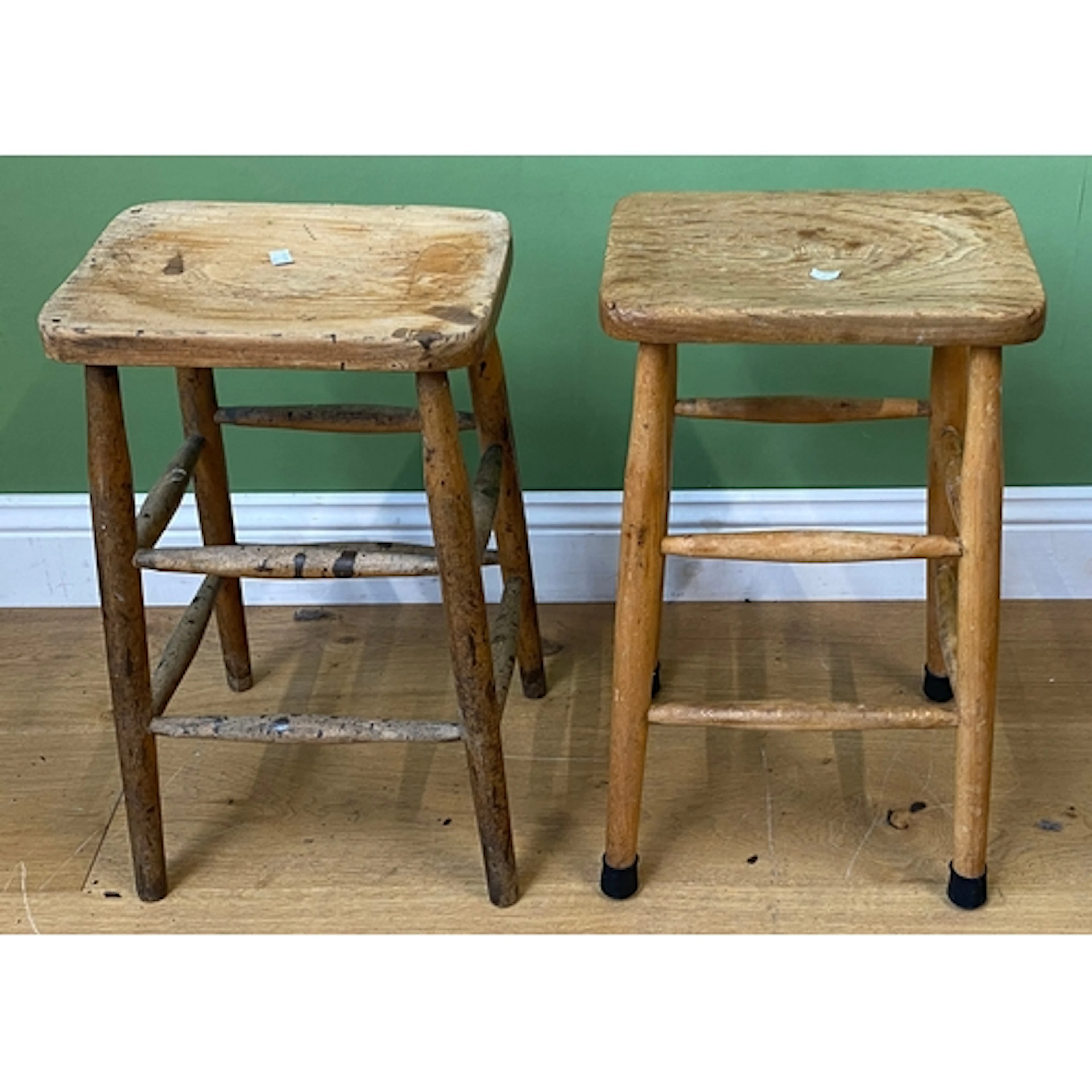 A pair of beech and elm high stools, 58cmH & 59cmH