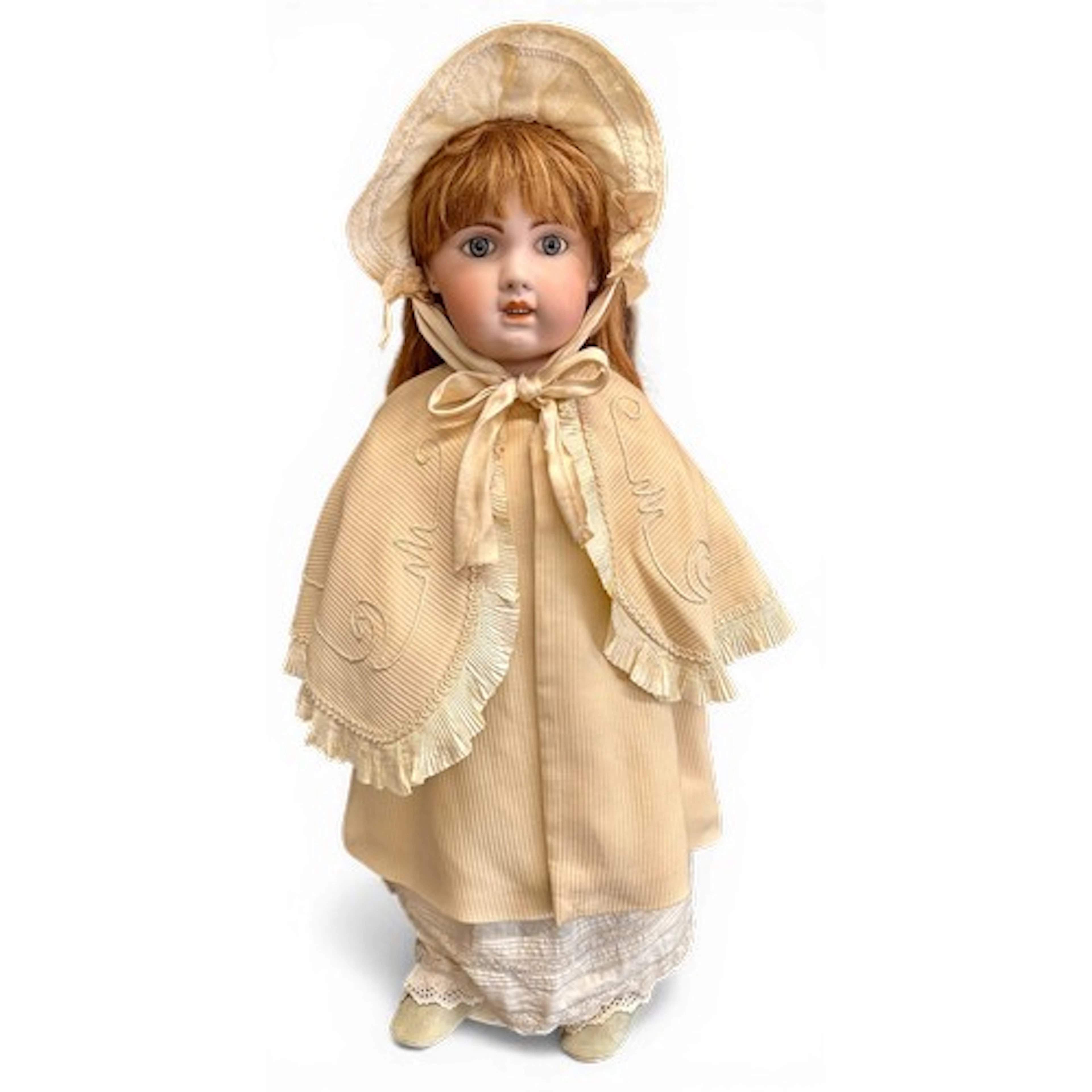 A Jumeau 1907 bisque doll on stand. Impressed 1907 & 14 to n...