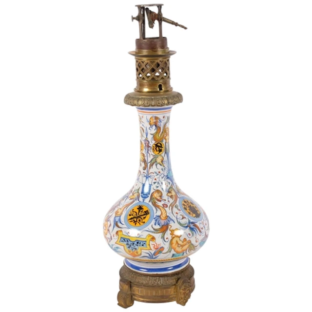 A 19th century French Majolica pottery oil lamp with brass m...