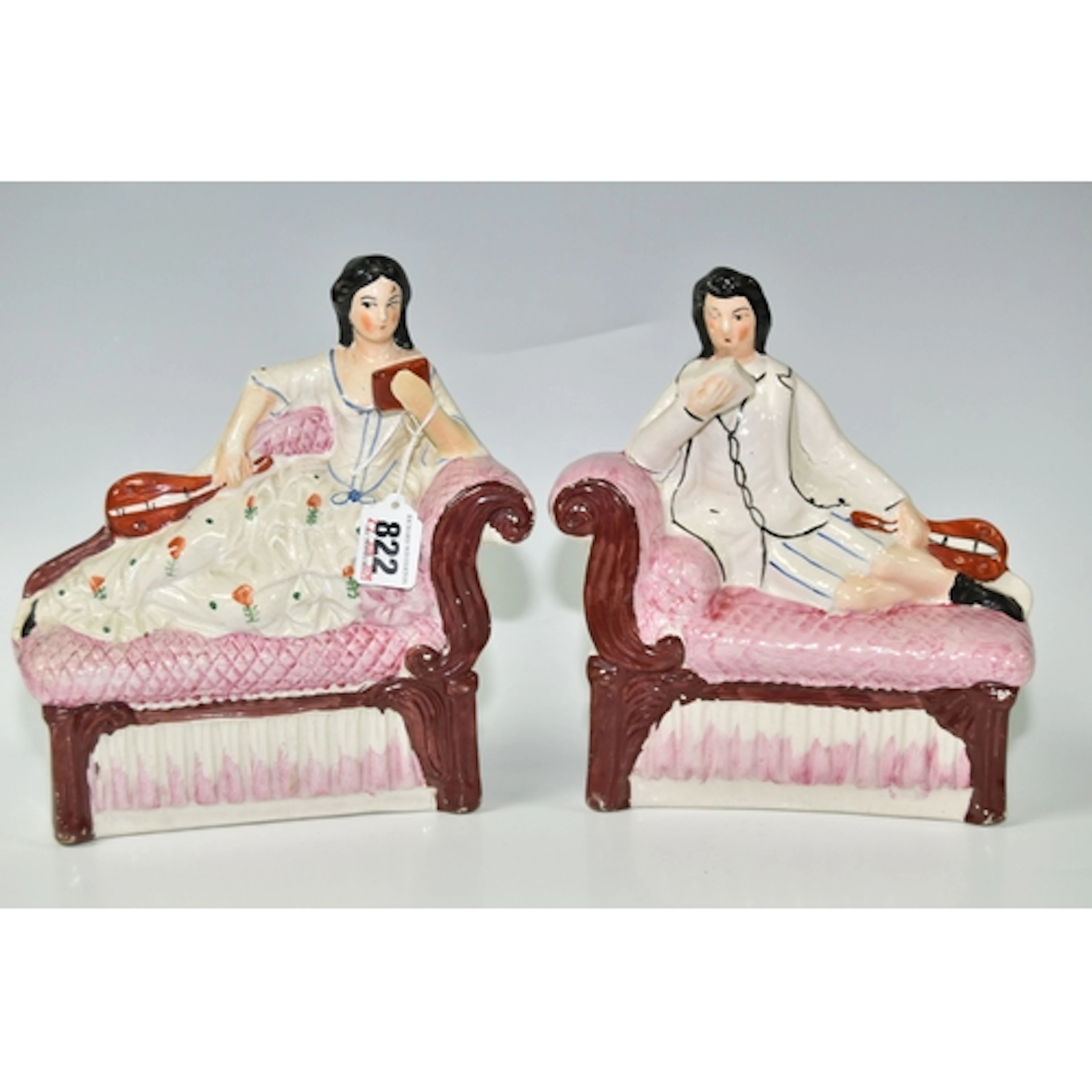 A PAIR OF 19TH CENTURY STAFFORDSHIRE FLATBACK FIGURES, depic...