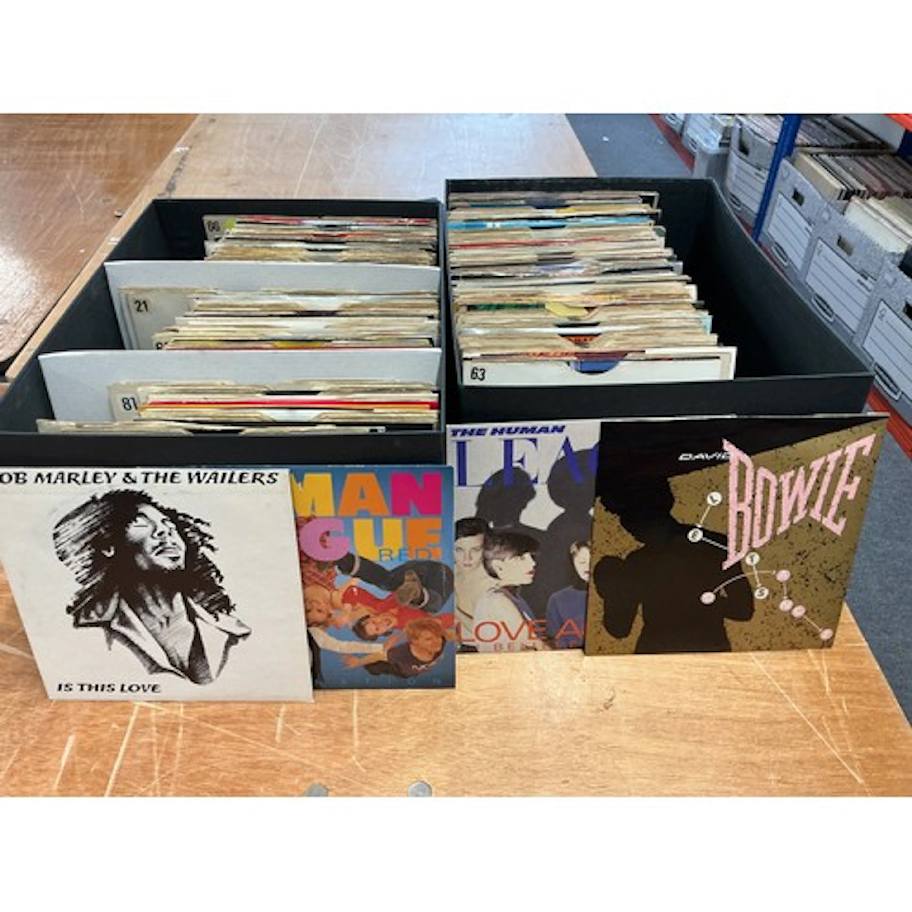 Ten boxes of 7” singles by various artists including The Rol...